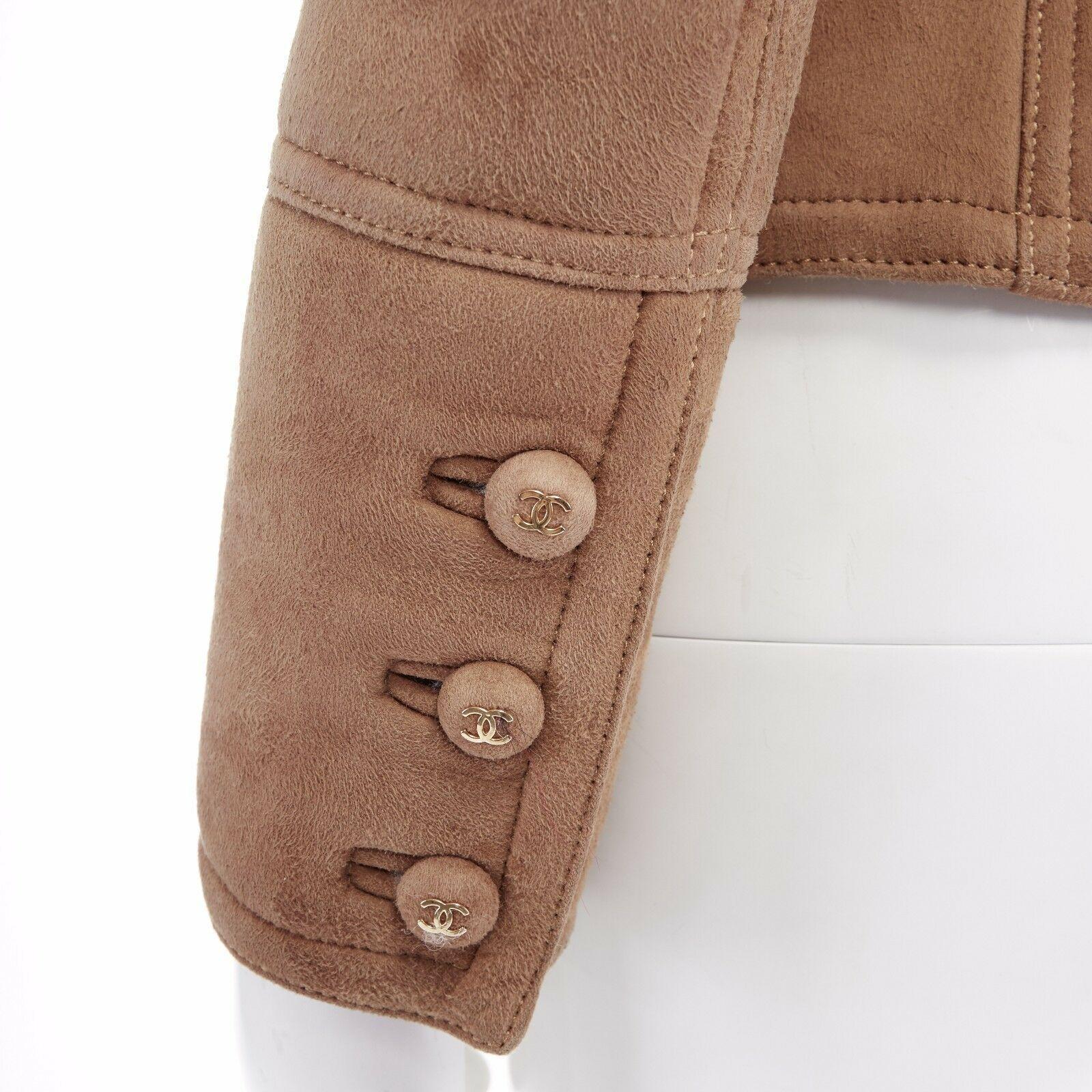 CHANEL Vintage 96A brown suede shearling lined cropped aviator jacket FR38 US4 S

CHANEL
FROM THE FALL WINTER 1996 COLLECTION
Light brown suede leather outer . Cream shearling lining . Spread collar with shearling trimming . Zip front closure with