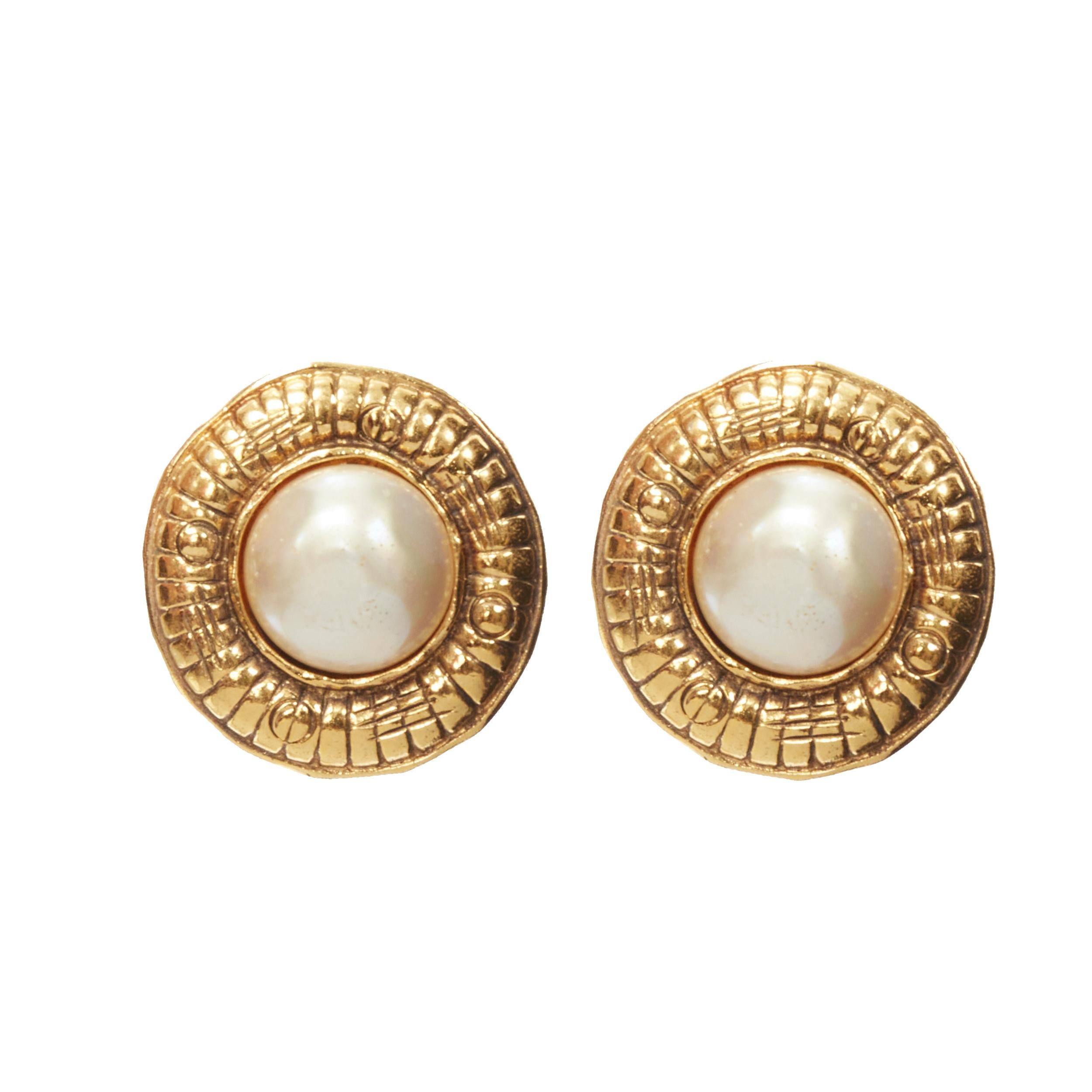 CHANEL Vintage antique gold-tone quilted faux pearl clip on earring 
Reference: GIYG/A00227 
Brand: Chanel 
Designer: Karl Lagerfeld 
Material: Metal 
Color: Silver 
Pattern: Solid 
Closure: Clip On 
Extra Detail: Antique gold-tone metal rim with