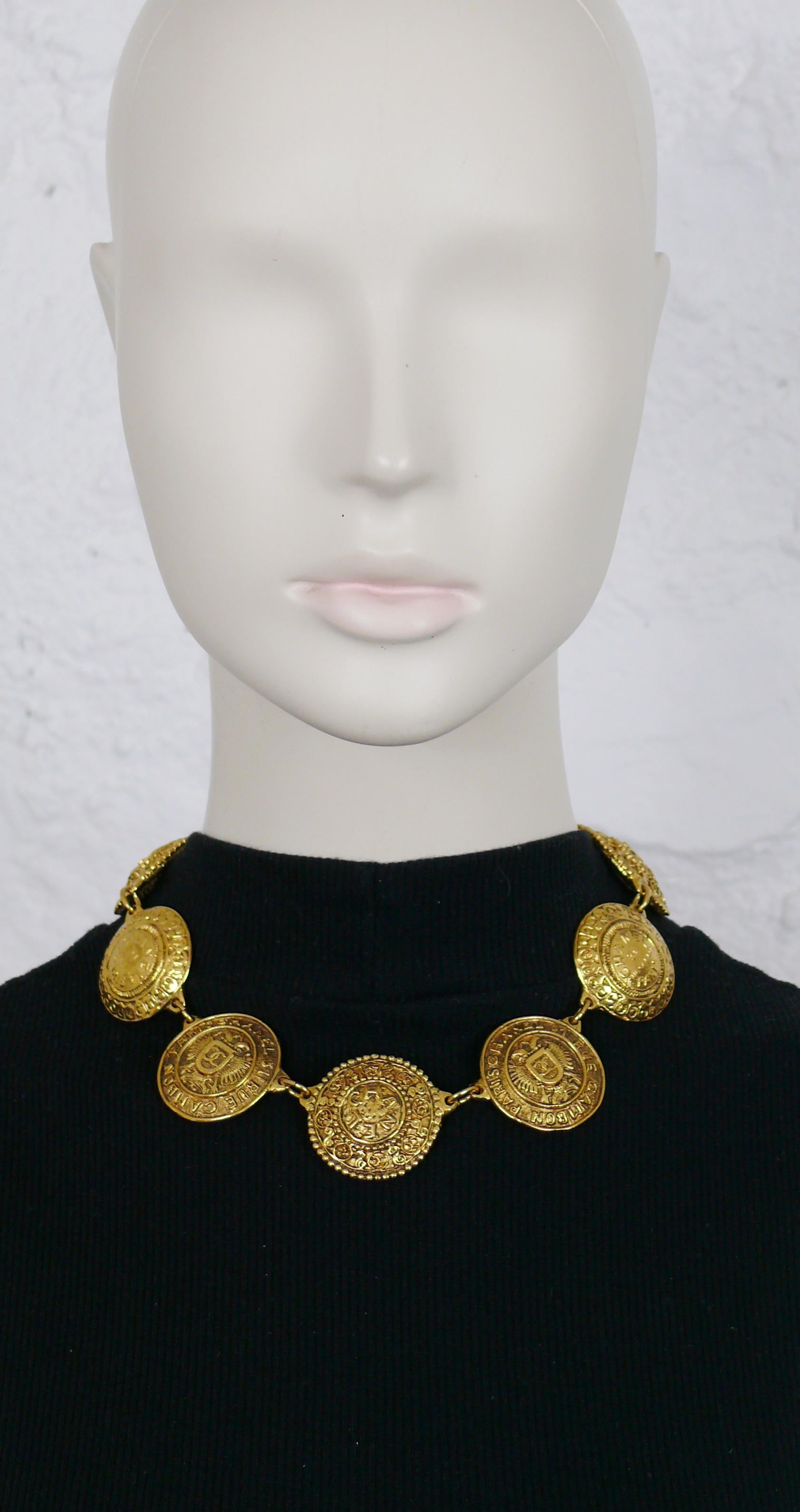 CHANEL vintage antiqued gold toned coat of arms medallion collar necklace.

Four medallions are embossed with CHANEL 31 RUE DE CAMBON PARIS, double-headed eagle and CC logo.
Three medallions are embossed with CHANEL surrounded with ornate