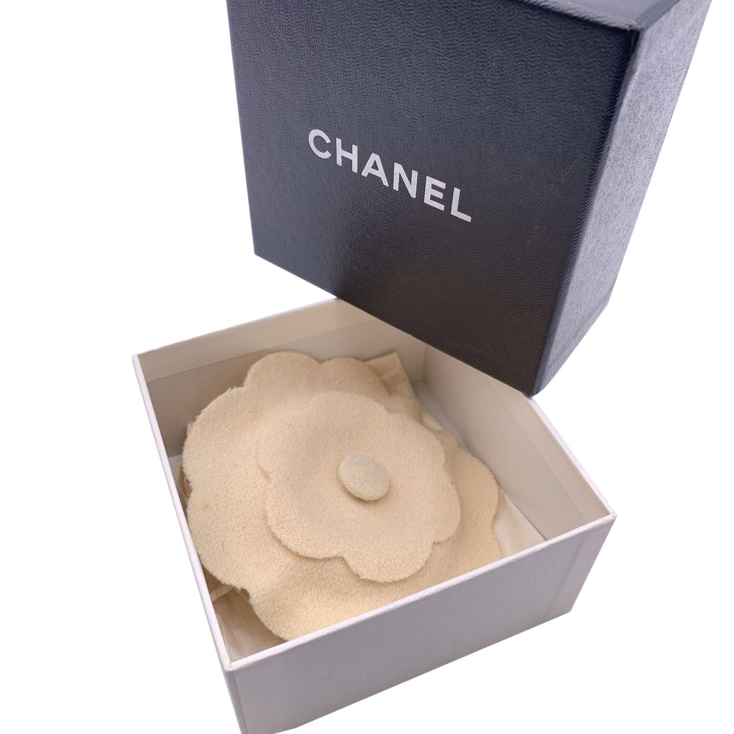 Chanel Vintage Camelia Camellia Flower Pin Brooch. Crafted of beige felt. Safety pin closure. Measurements diameter: 4.5 inches - 11.5 cm. 'CHANEL - CC - Made in France' oval tab on the back Condition A - EXCELLENT Gently used. Chanel box included.