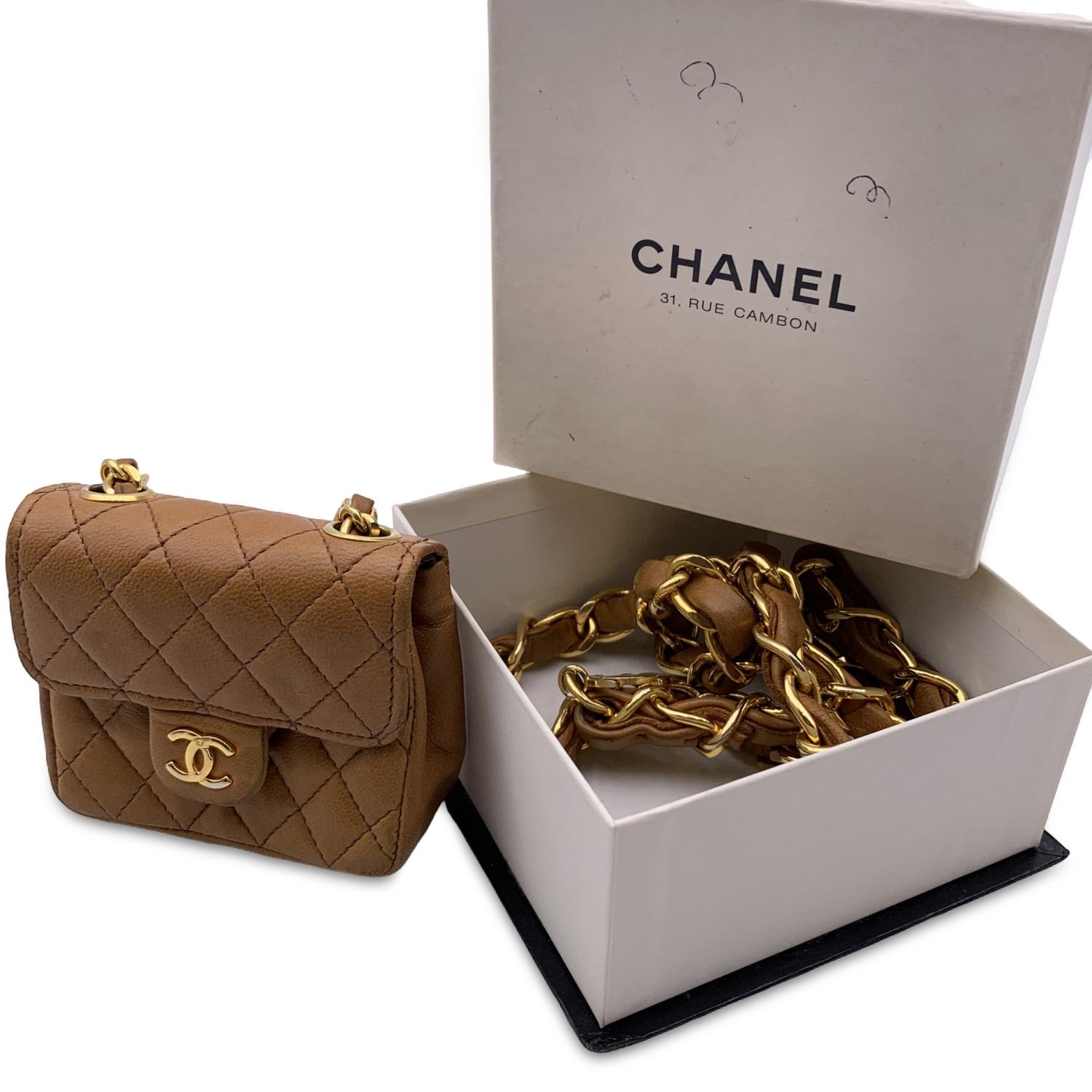 This beautiful Bag will come with a Certificate of Authenticity provided by Entrupy. The certificate will be provided at no further cost.

Classic vintage Chanel gold metal chain belt with classic flap micro bag . Gold metal chain belt with