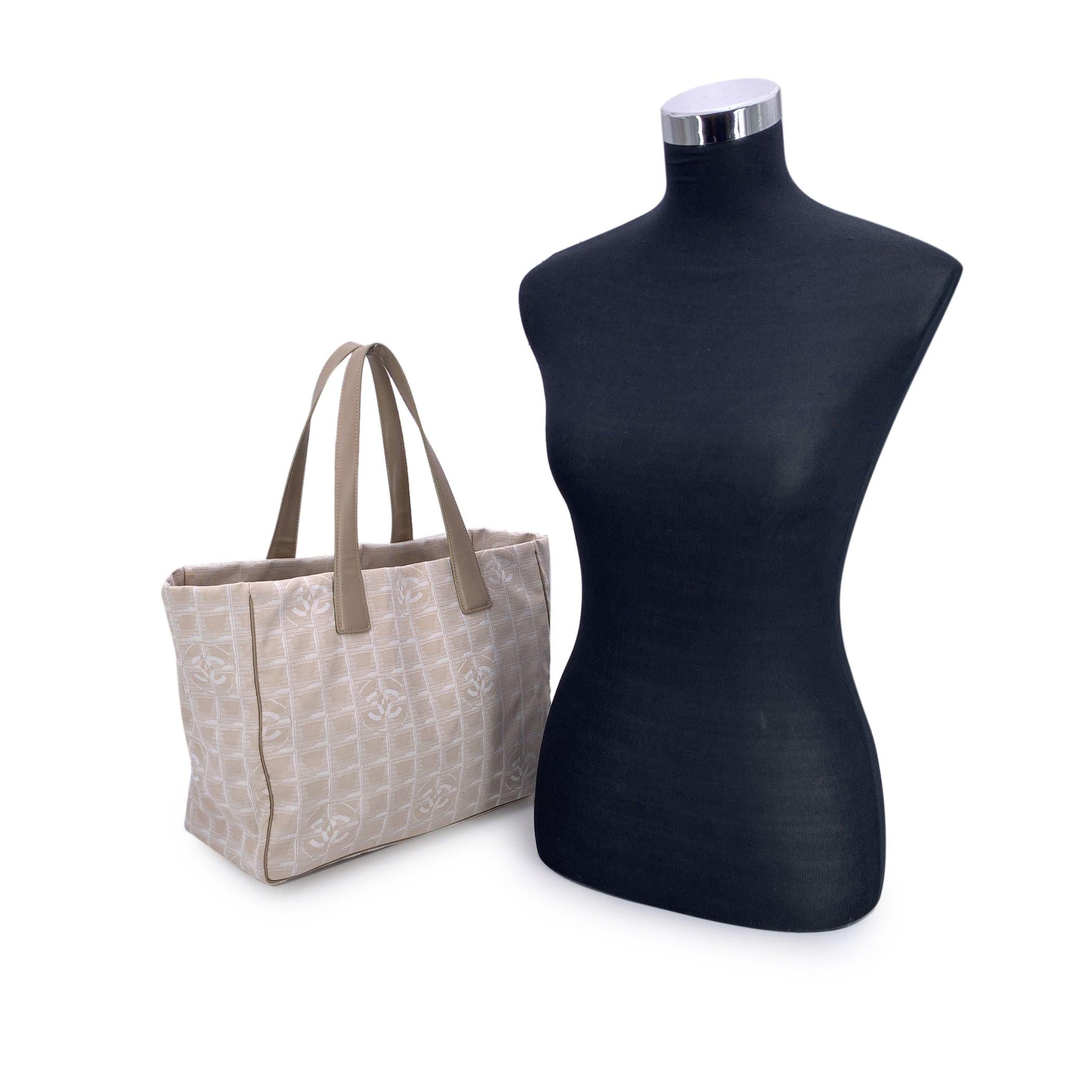 Chanel Vintage Travel Line Tote - A Jet-Set Icon from 2003/2004 From the golden age of early-2000s Chanel design comes this refined Chanel Travel Line tote, a quiet emblem of timeless luxury and effortless functionality. Released during the