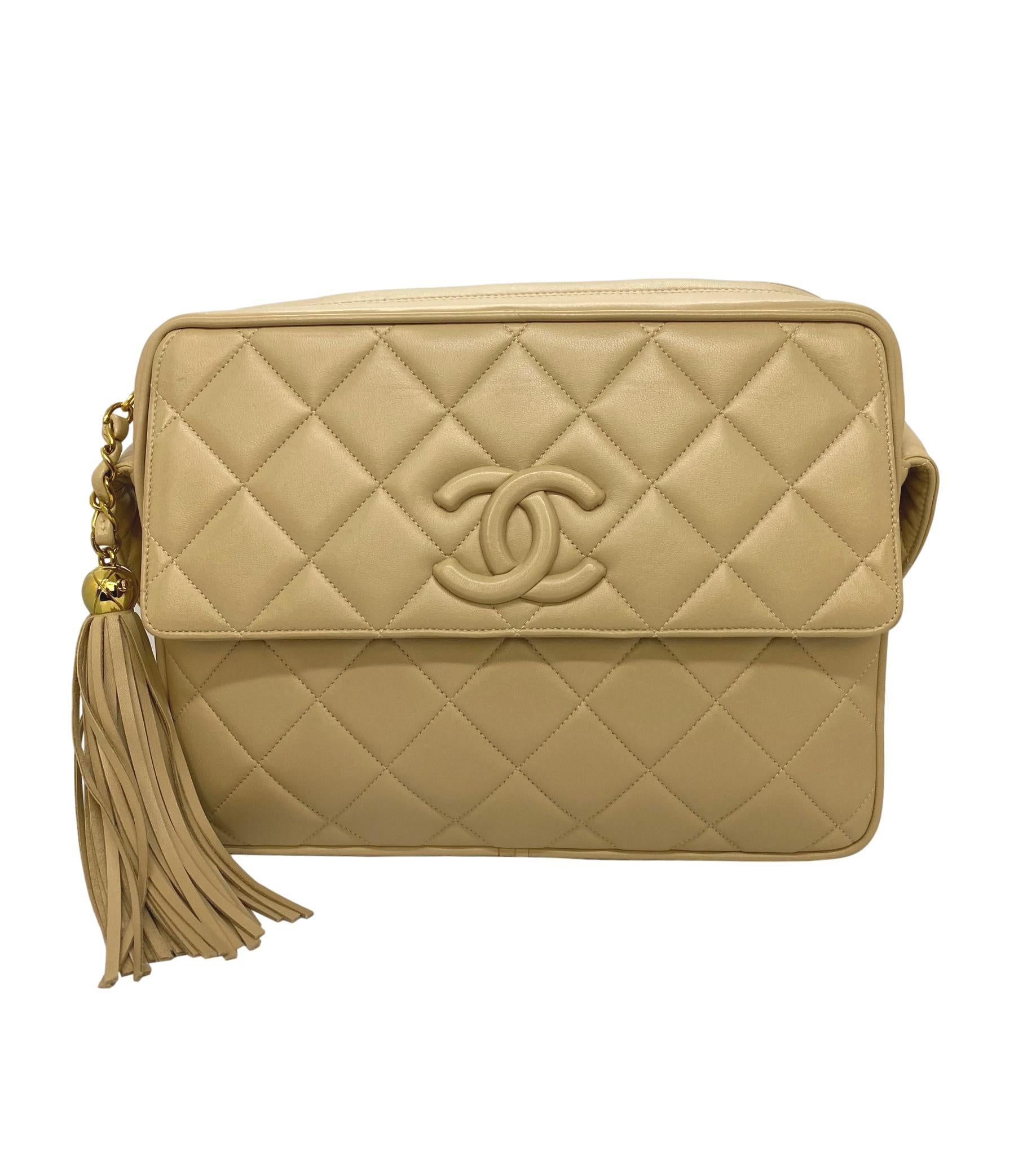 Chanel Vintage Beige Quilted Lambskin Leather Camera Bag with Gold Hardware. This highly coveted and rare collectible crossbody camera bag was produced between 1994 - 1996, baring a serial code of 