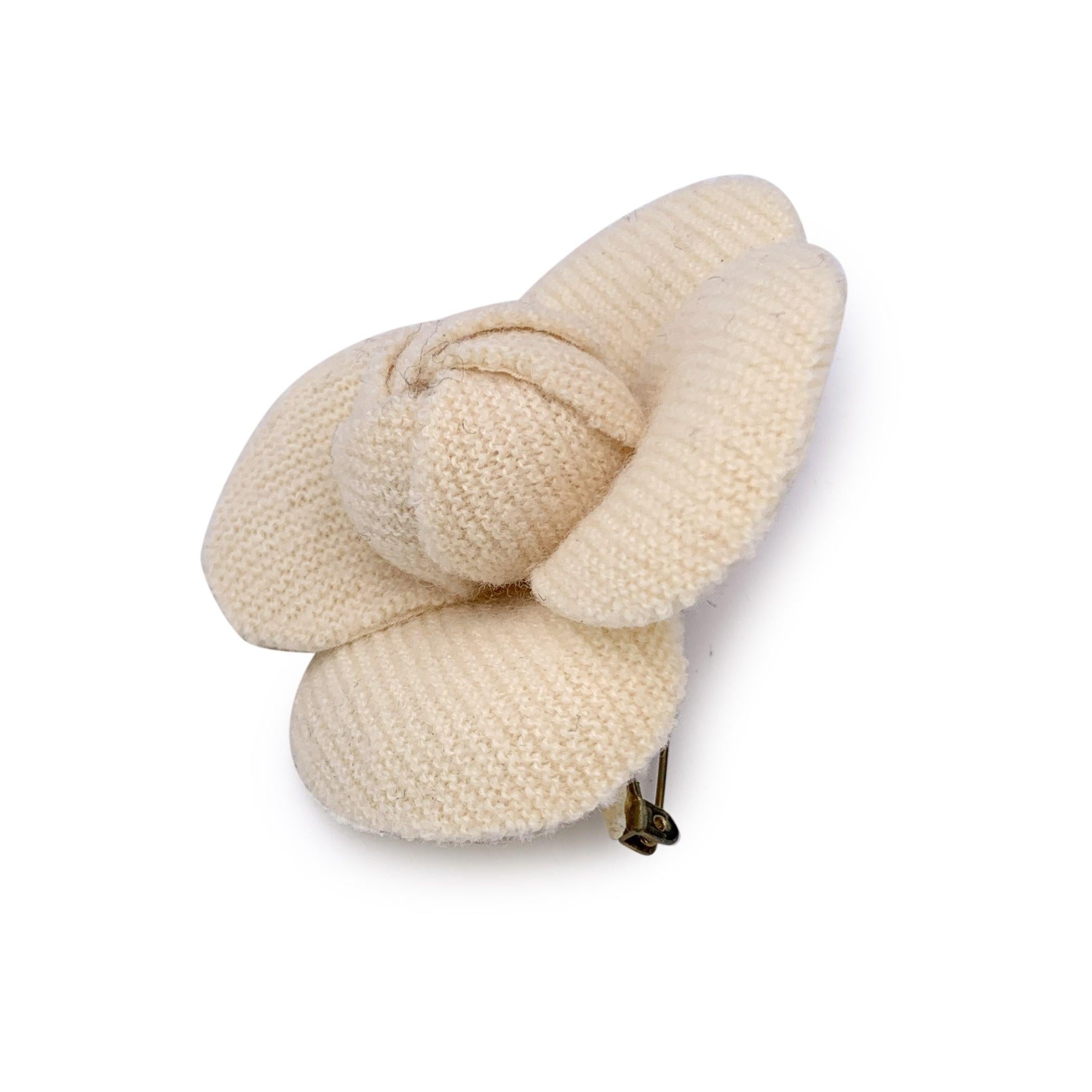 Embrace the timeless elegance of Chanel with this Vintage Camellia Flower Pin Brooch, a true collector's piece that captures the essence of French luxury. The brooch features soft beige tweed petals, meticulously crafted to showcase the delicate