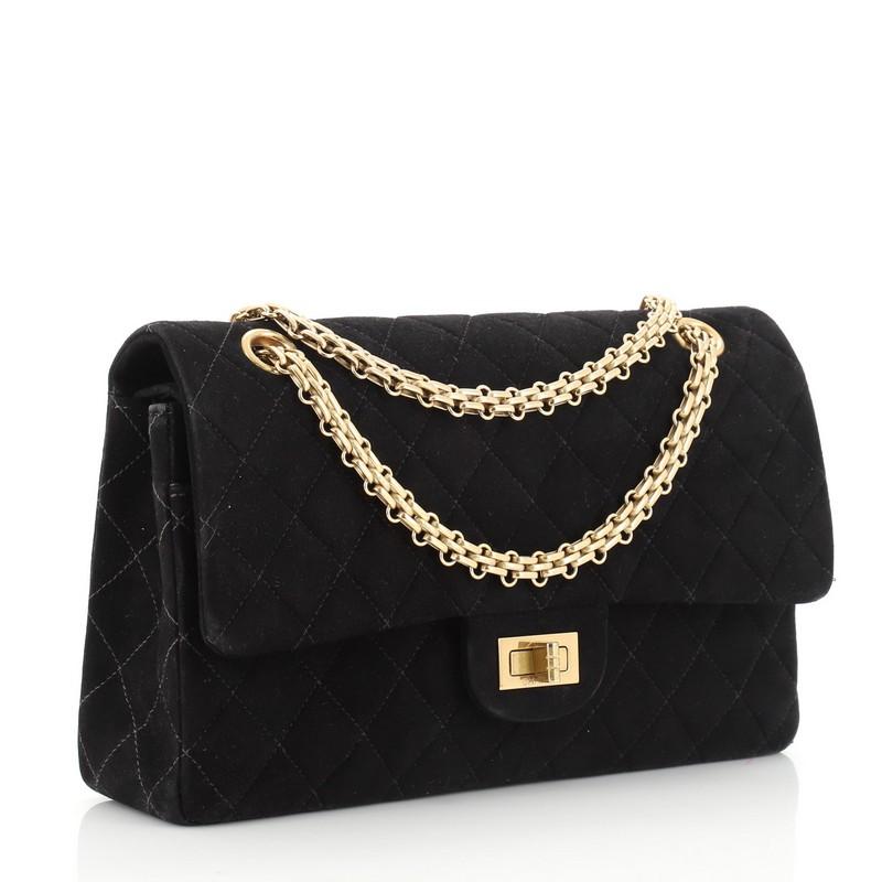 This Chanel Vintage Bijoux Chain Mademoiselle Flap Bag Quilted Suede Medium, crafted from black quilted suede, features bijoux chain link strap and gold-tone hardware. Its mademoiselle turn-lock closure opens to a black leather interior. Hologram
