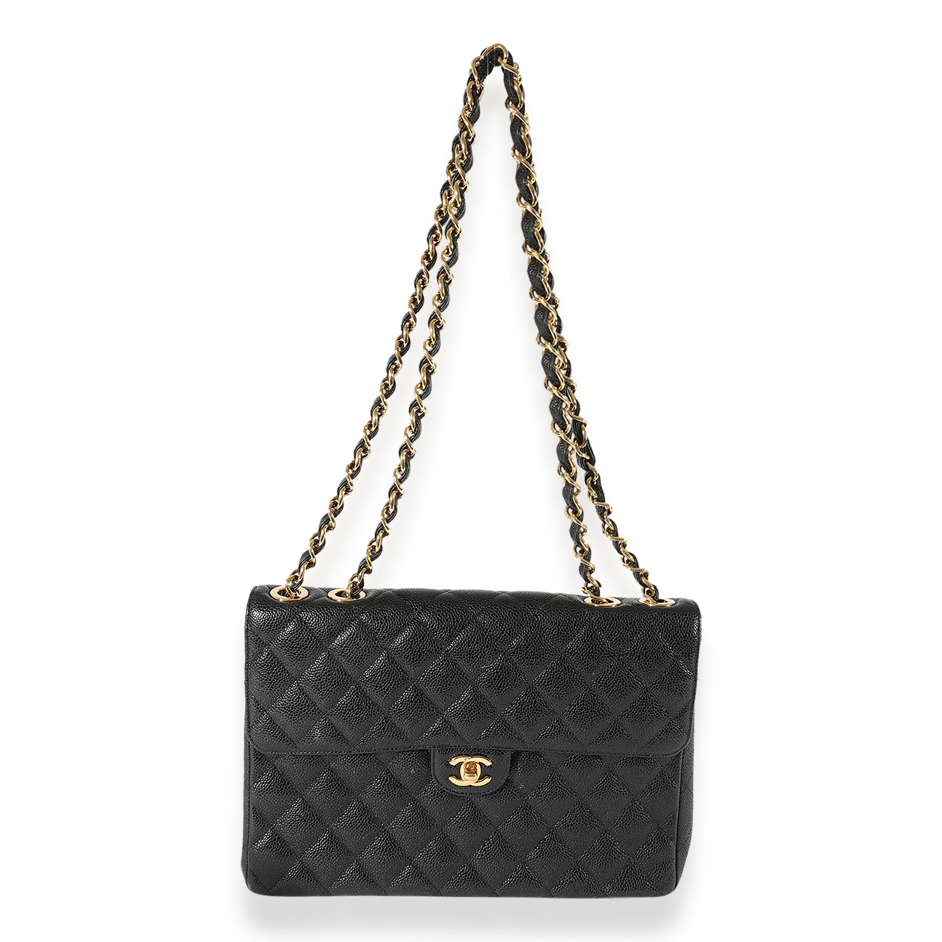 Listing Title: Chanel Vintage Black Caviar 24K Jumbo Classic Flap
SKU: 125218
Condition: Pre-owned 
Handbag Condition: Very Good
Condition Comments: Very Good Condition. Heavy exterior corner scuffing and marks throughout. Scratching at hardware.