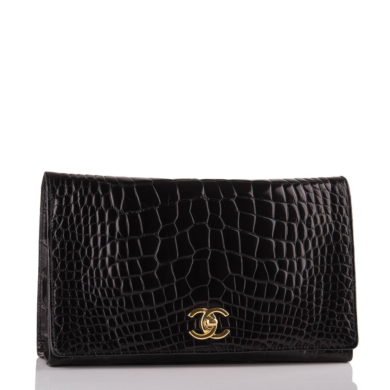 Chanel Vintage black crocodile full flap with gold hardware.

This bag has a front flap with signature CC turnlock closure and 24k gold chain link strap.

The interior is lined in black leather and features one zip pocket on the front wall and a