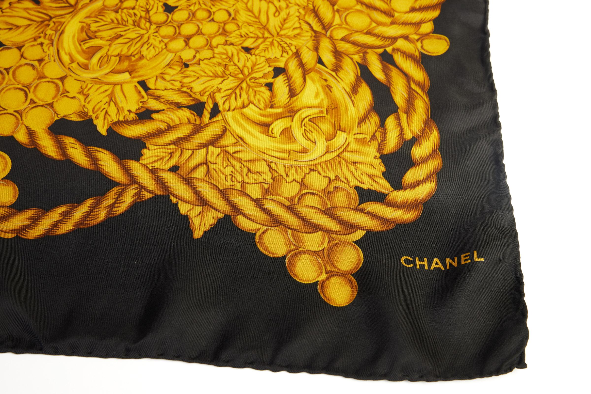 Chanel vintage black silk scarf with gold grapes and logos. Hand rolled edges. Excellent vintage condition with very minor wear. 