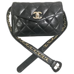Chanel Vintage black lamb waist bag fanny pack with golden chain belt and CC