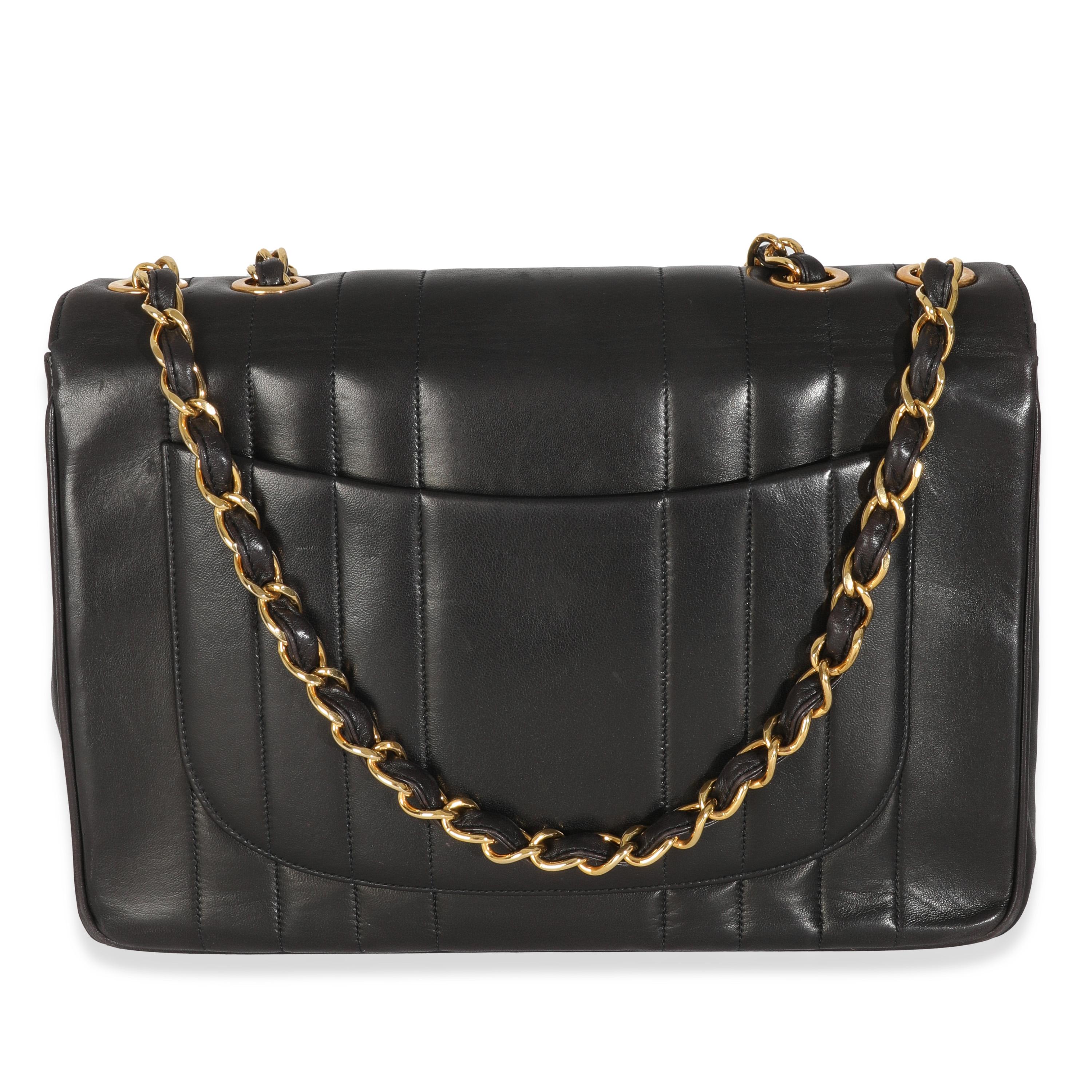 Listing Title: Chanel Vintage Black Lambskin Vertical Stitch Jumbo XL Flap Bag
SKU: 146714
Condition: Pre-owned 
Condition Description: A timeless classic that never goes out of style, the flap bag from Chanel dates back to 1955 and has seen a