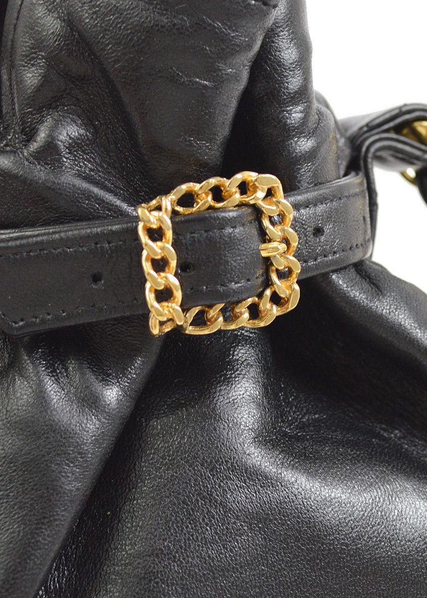Chanel Vintage Black Leather Gold Buckle Bucket Evening Mini Small Top Handle Bag

Leather
Gold tone hardware
Woven lining
Made in France
Handle drop 7