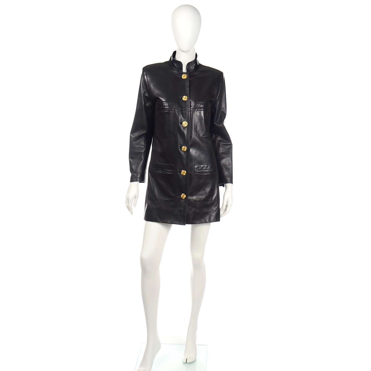 This sensational vintage Chanel leather jacket is one of our favorite pieces this year! This fabulous coat is in a supple soft black leather and buttons up the front with Chanel's iconic 4 leaf clover gold metal buttons. The jacket has a mandarin