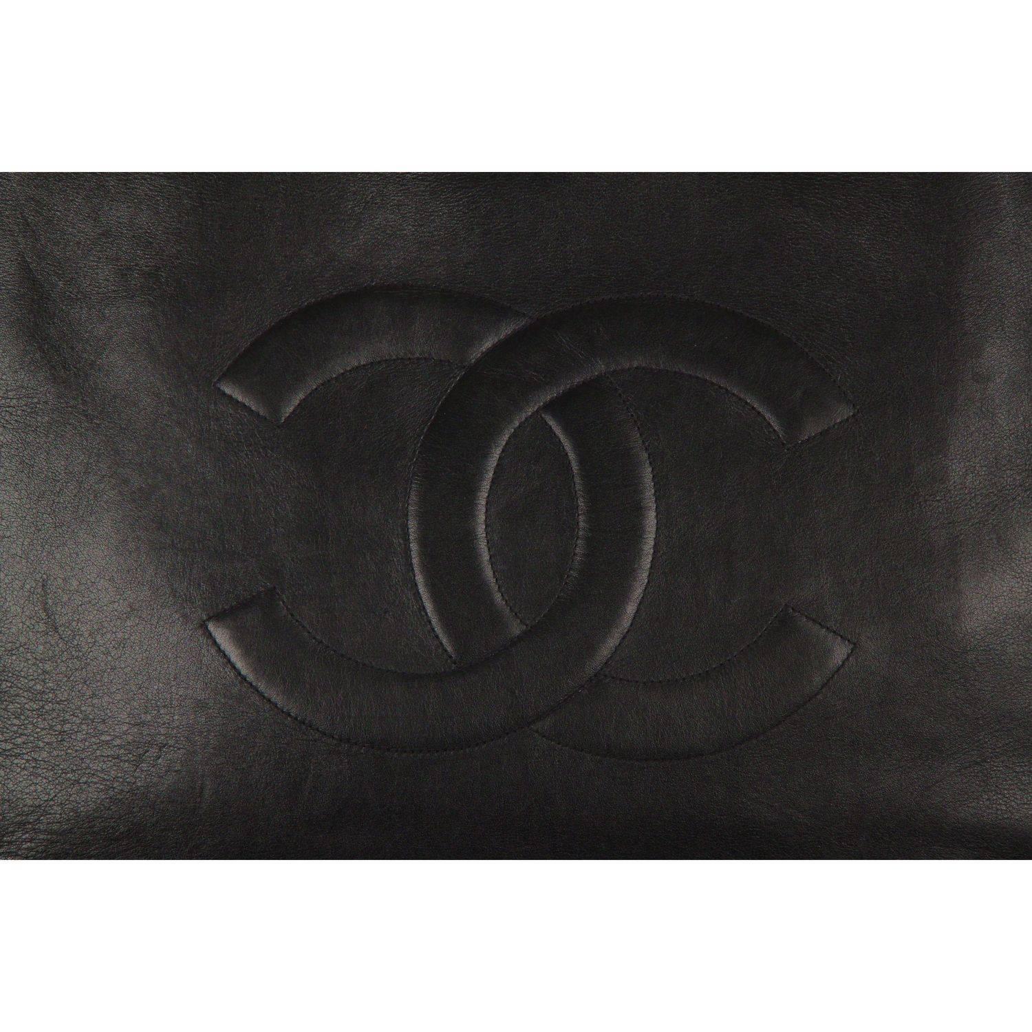 - Chanel Large Tote
- Black lambskin leather
- Big CC logo embroidered on the front
- Open top 
- Chunky gold metal and interwoven  leather shoulder straps
- Leather interior
- 1 side zip pocket inside

Logos & tags: 'CHANEL' & 'Made in France'