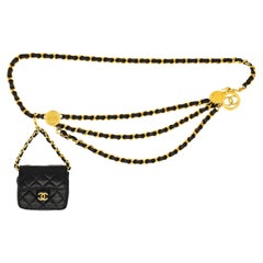 Chanel Retro Black Leather Micro Flap Bag on Triple Swag Medallion Belt, 1984.