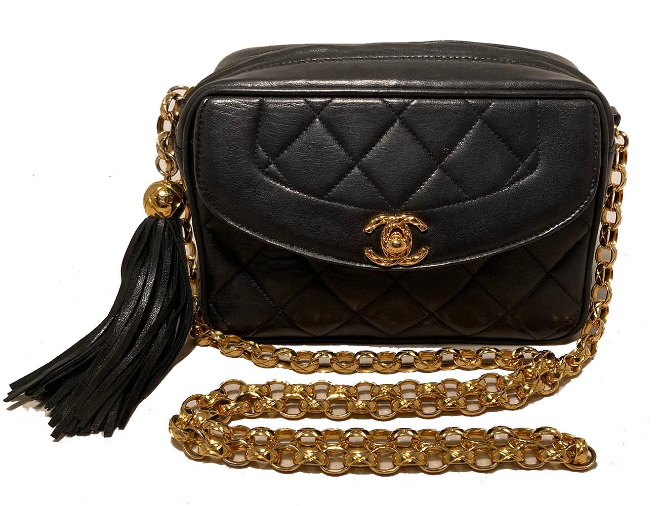 Chanel Vintage Black Leather Tassel Camera Bag in very good condition. Quilted black lambskin leather trimmed with gold hardware. Exterior front flap pocket opens via gold CC logo twist closure. Top zipper opens main compartment which is lined in