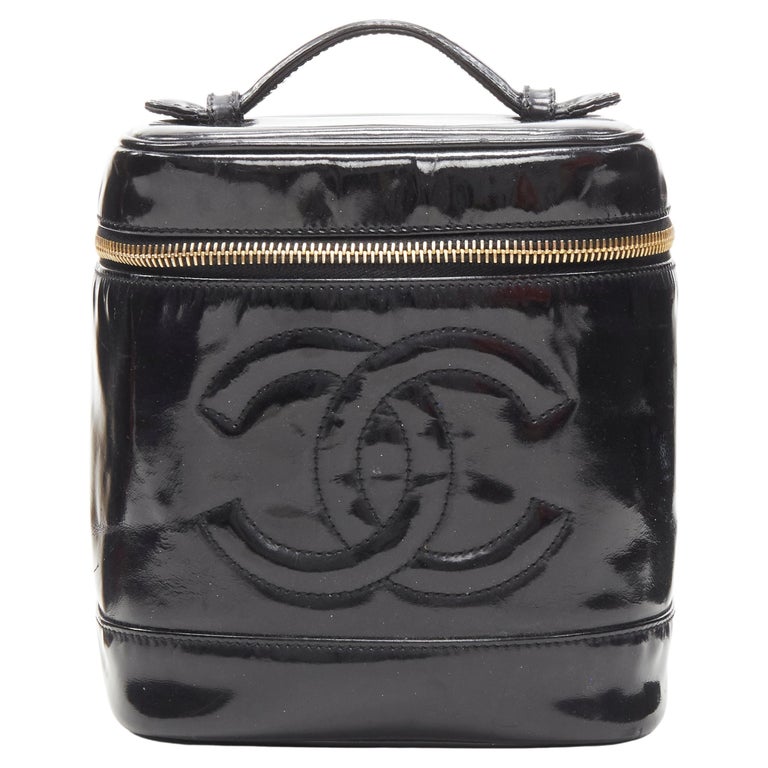 CHANEL Vintage black patent leather CC logo top handle Vanity bag For Sale  at 1stDibs | borsa chanel vernice nera, chanel pouch with handle