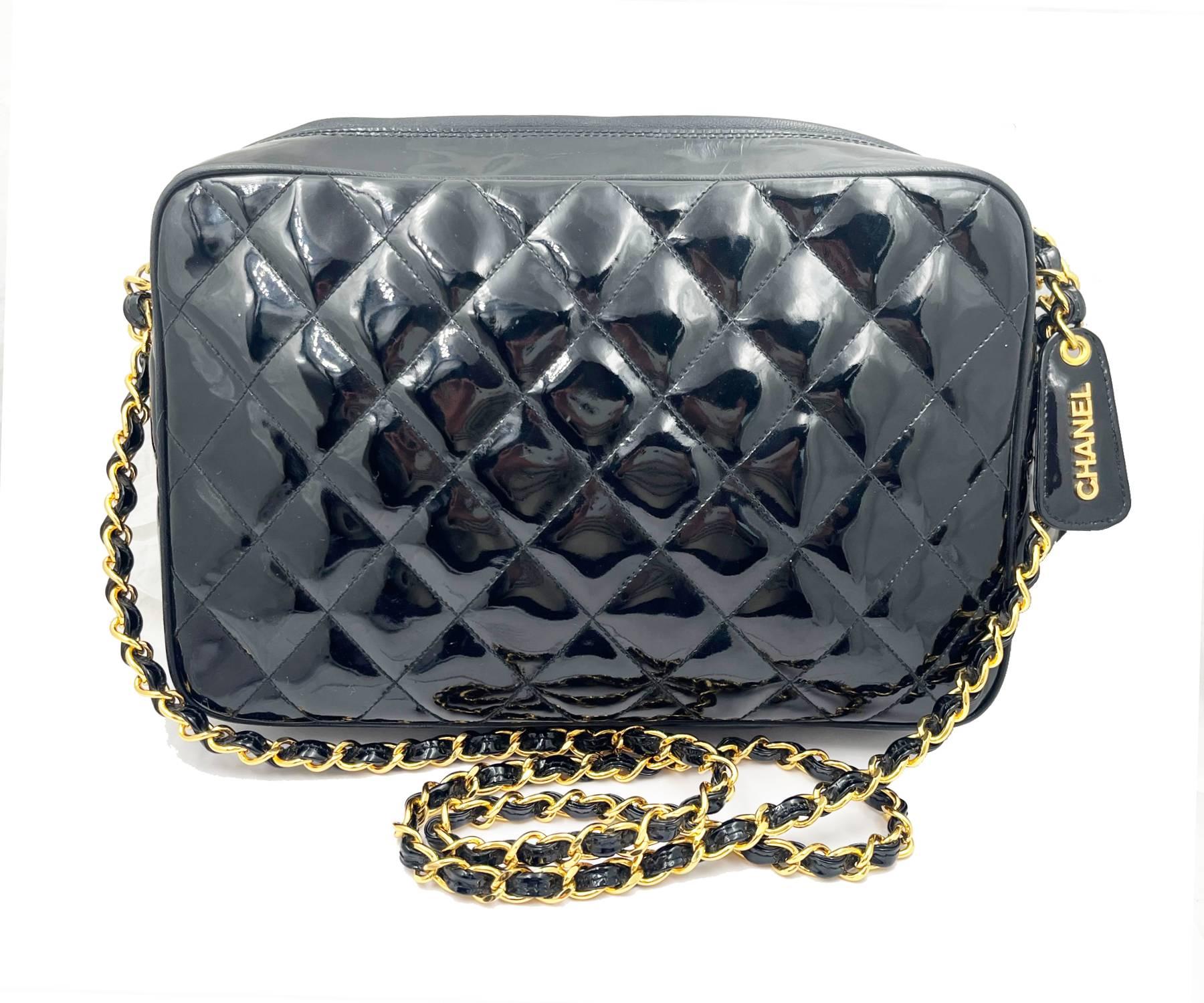 Chanel Vintage Black Patent Leather Large Camera Cross Body Bag

*385 XXXX
*Made in Italy
*Comes with the original box and booklet
*24K gold plated hardware

-It is approximately 10″ x 6.75″ x 2.75″.
-The chain is approximately 20″ drop.
-It has