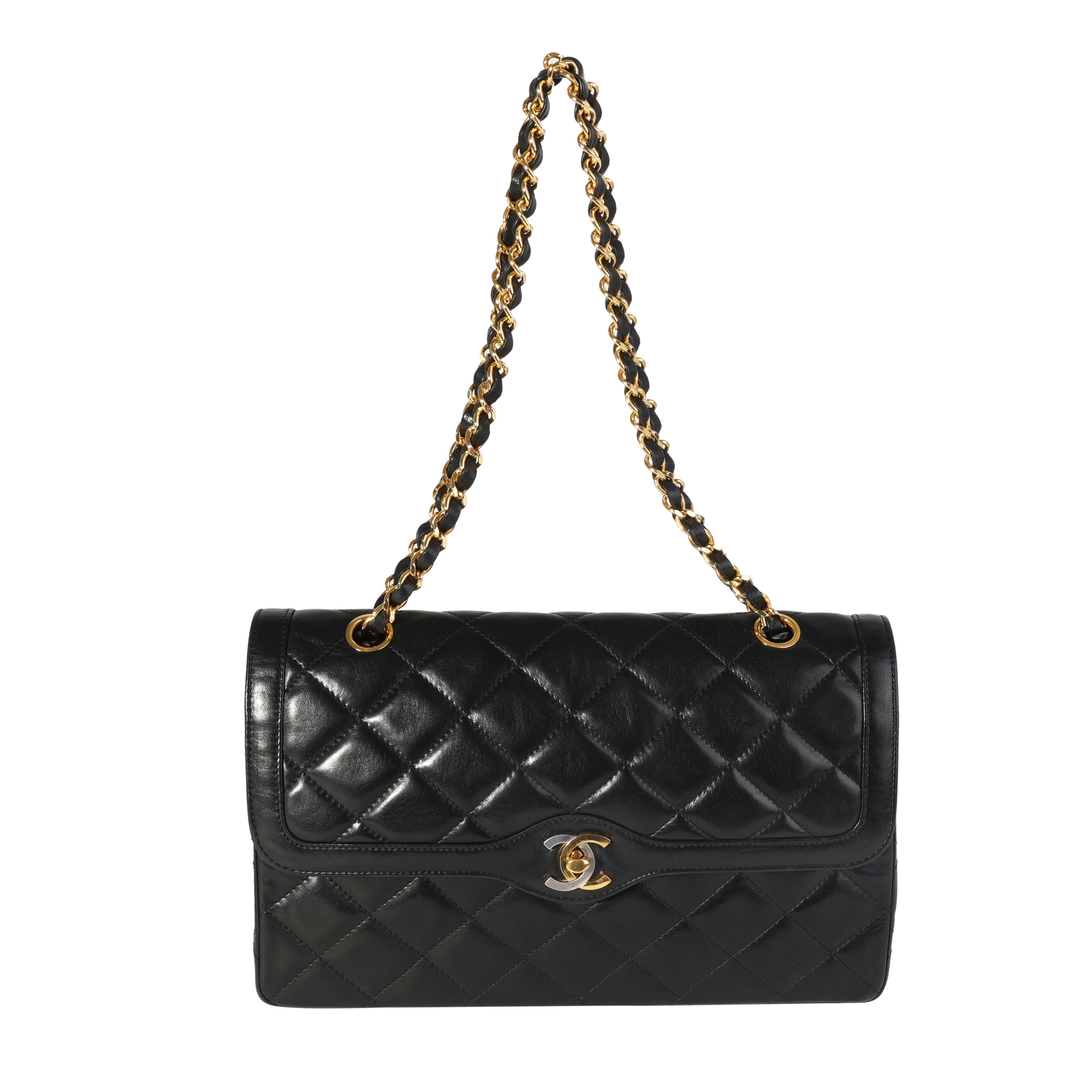 Listing Title: Chanel Vintage Black Quilted Lambskin Double Flap Bag
SKU: 117803
Condition: Pre-owned 
Handbag Condition: Very Good
Condition Comments: Very Good Condition. Light scuffing to corners. Scuffing and indentation to exterior leather.