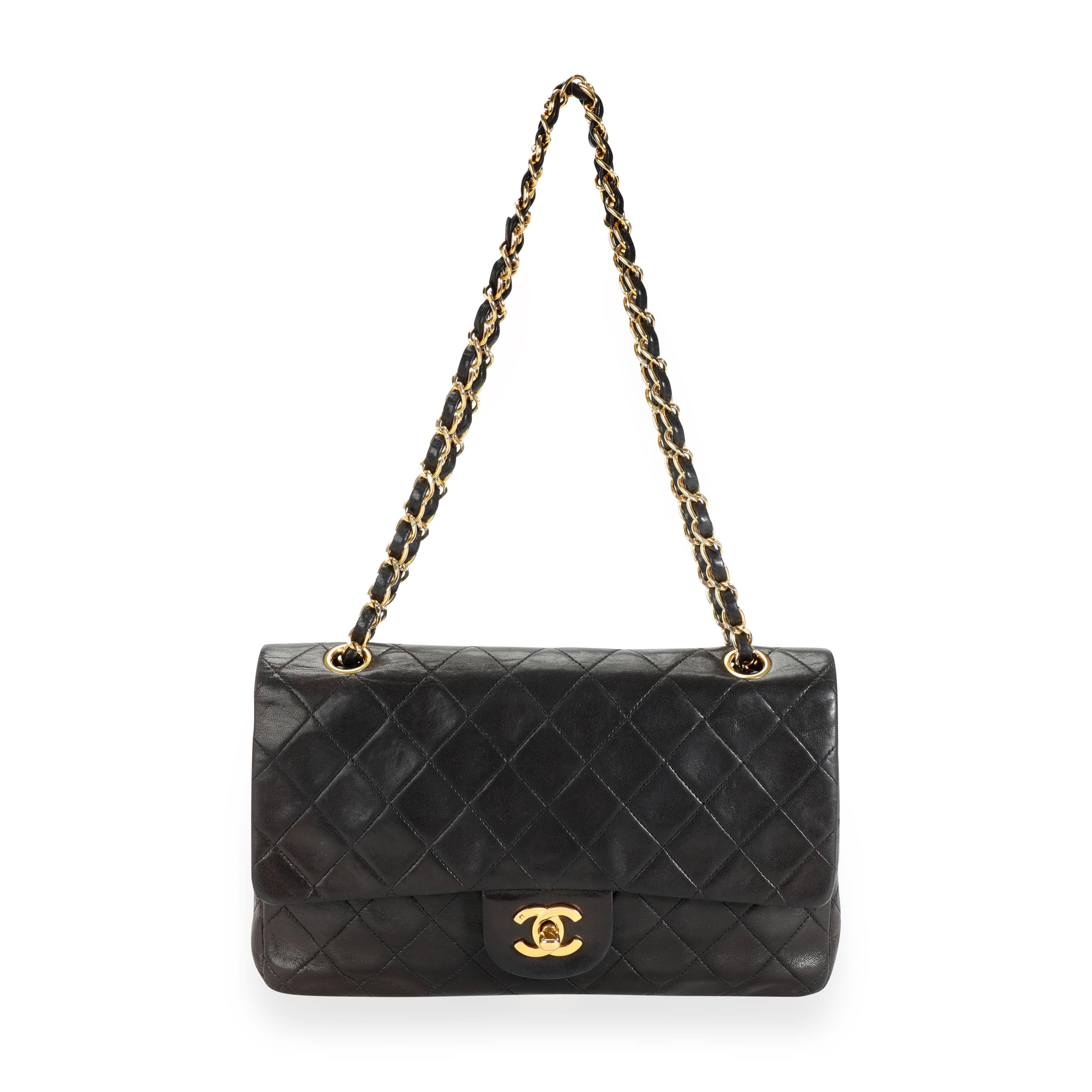 Chanel Vintage Black Quilted Lambskin Medium Classic Double Flap Bag
SKU: 111044

MSRP: USD 6,800.00
Handbag Condition: Good
Condition Comments: Good Condition. Scuffing to corners. Discoloration throughout leather. Scratching to hardware. Scuffing