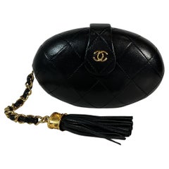CHANEL Vintage Black Quilted Lambskin Oval Clutch w/ Logo Tassel