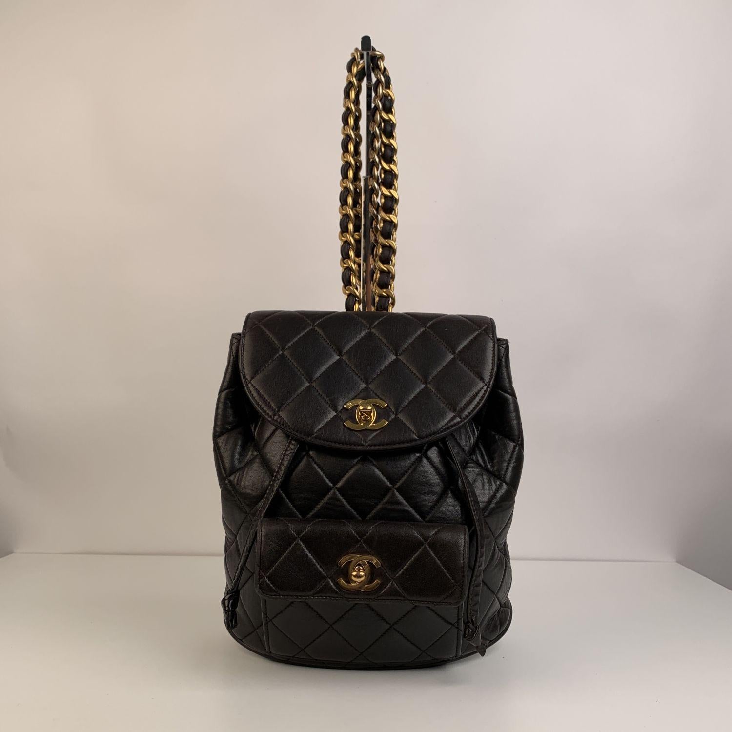 This bag will come with a Certificate of Authenticity provided by Entrupy, at no further cost.

Rare vintage Chanel backpack crafted in quilted black lambskin leather with gold-tone hardware. Iconic interwoven chain and leather adjustable shoulder