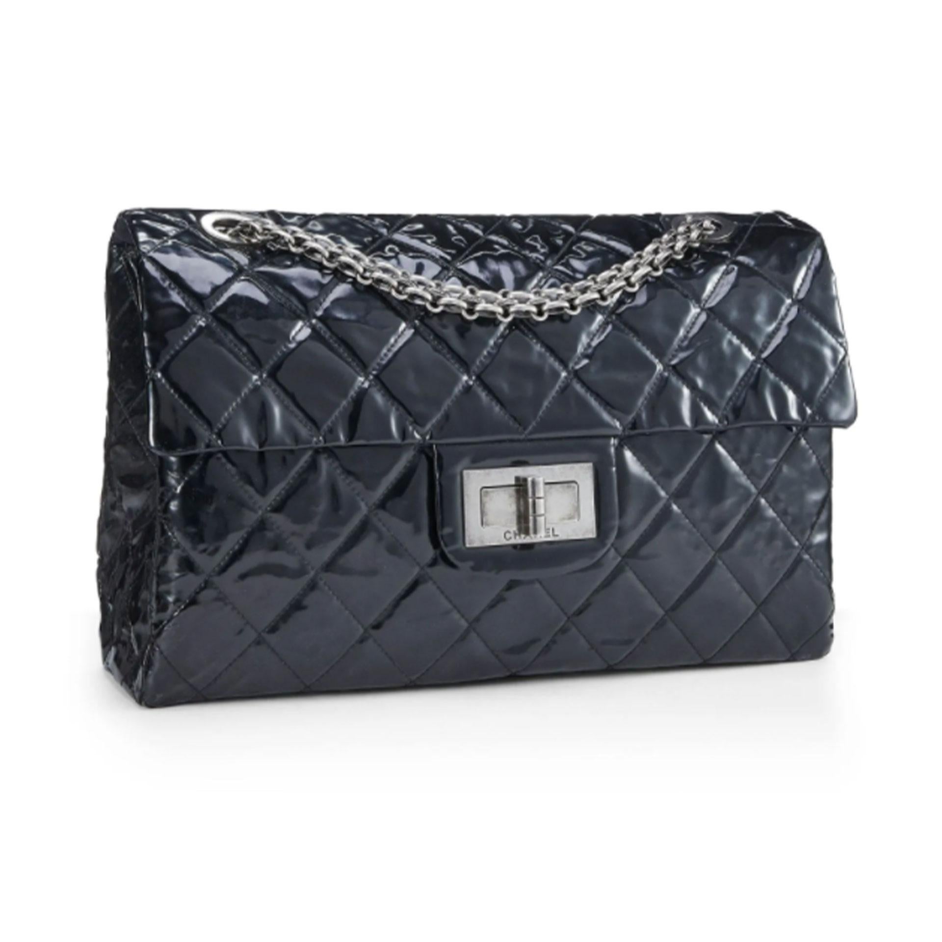Chanel Vintage Black Quilted Patent Leather Reissue Flap Bag XL Shoulder Bag

Spacious carry-all version of the classic Chanel Reissue Flap Bag featured in the XL size, rendered in black quilted patent leather and accented with Ruthenium Venetian