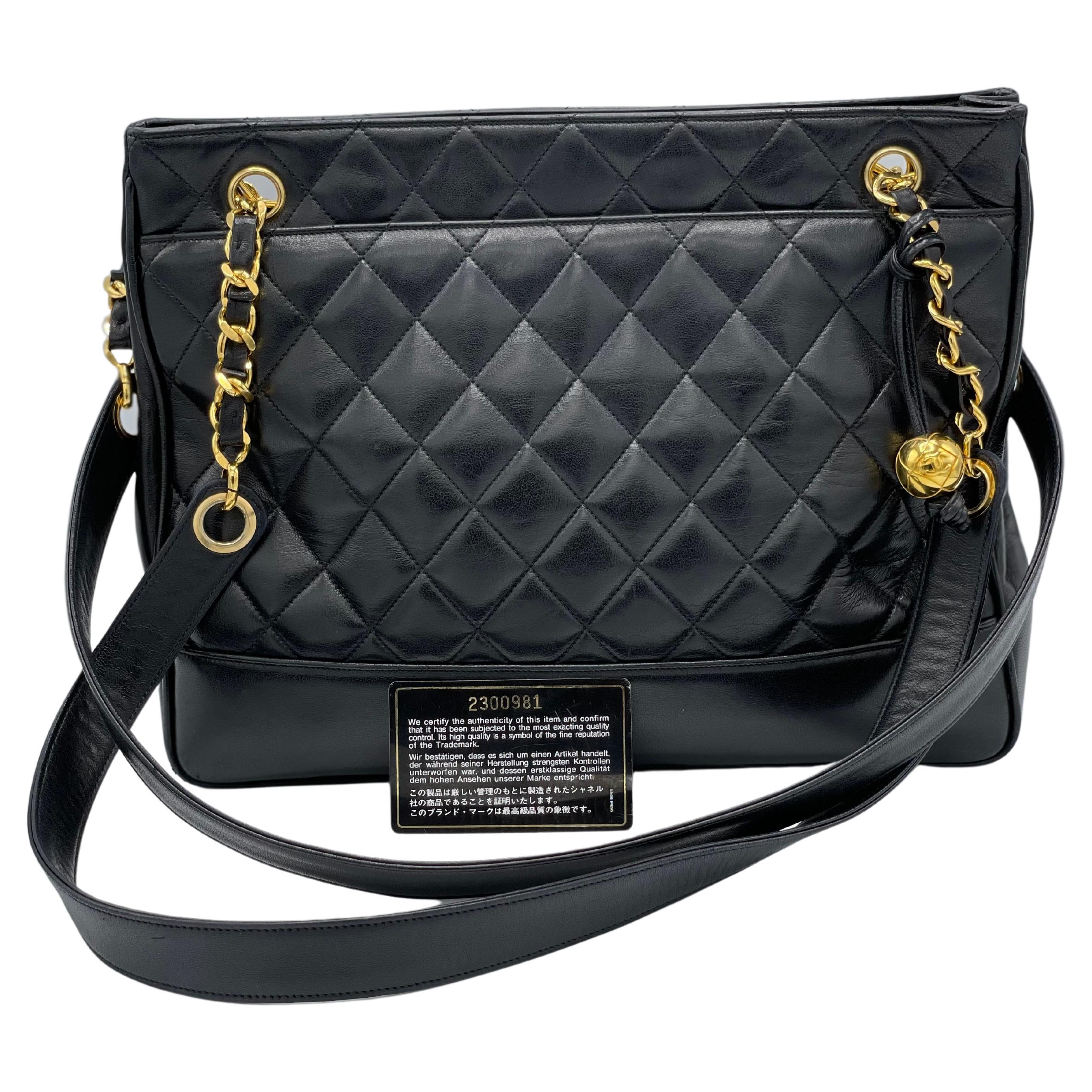 Chanel antique black leather shoulder bag with quilting and gold hardware. The two pockets are both functional and original. It has an inside zip pocket with golden embellishments. Dual leather shoulder straps with gold trim at the base. In