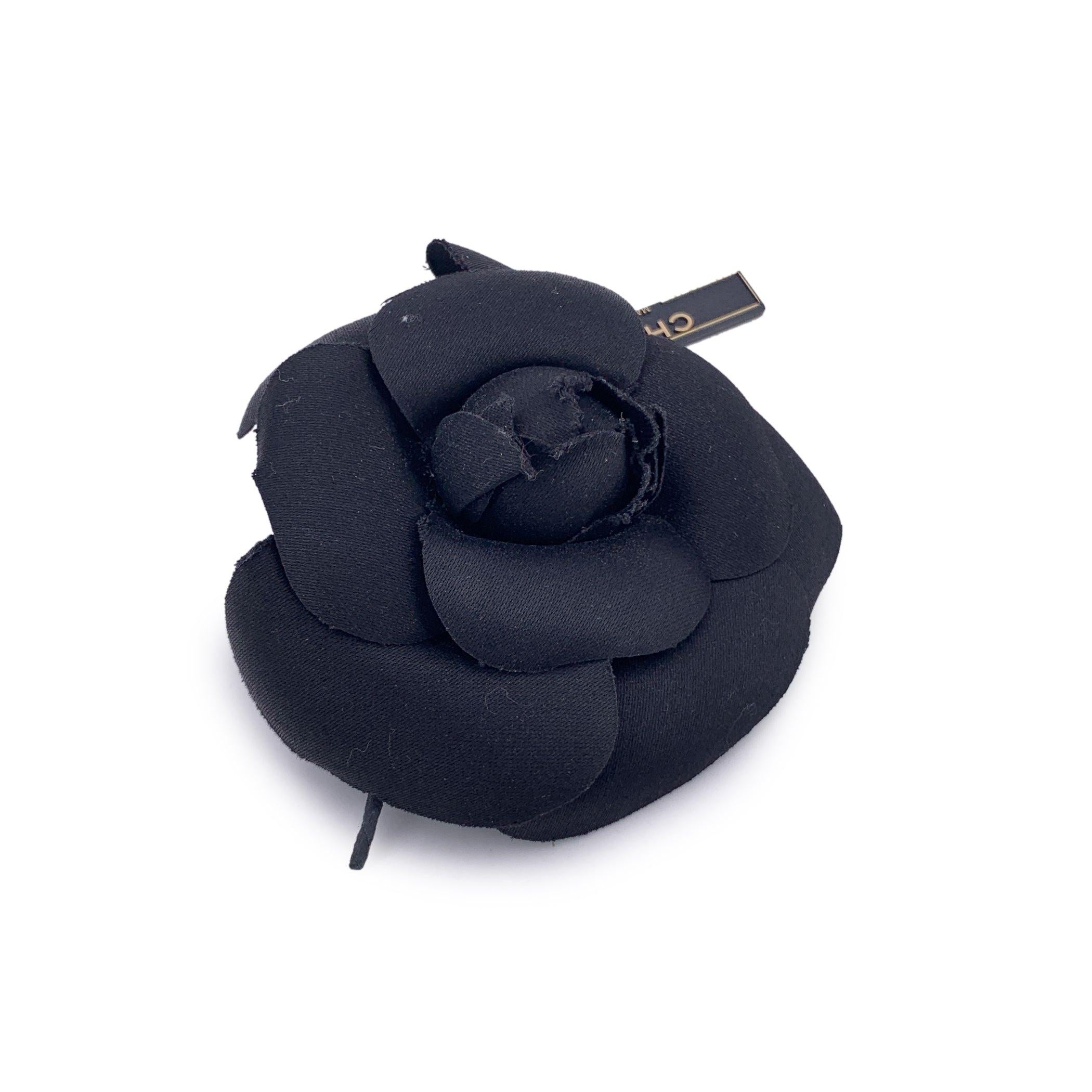 Chanel Vintage Camellia Flower Pin Brooch - Black Satin Timelessly feminine and unmistakably Chanel, this Vintage Camellia Flower Pin Brooch captures the Maison's enduring love for the iconic camellia bloom - a signature symbol of elegance and