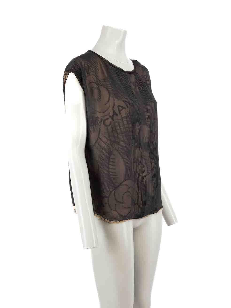 CONDITION is Very good. Minimal wear to top is evident. Minimal wear to fabric composition with a handful of small pulls and plucks to the weave found near the hem on this used Chanel designer resale item.
 
 Details
 Vintage
 Black
 Silk
 Top
