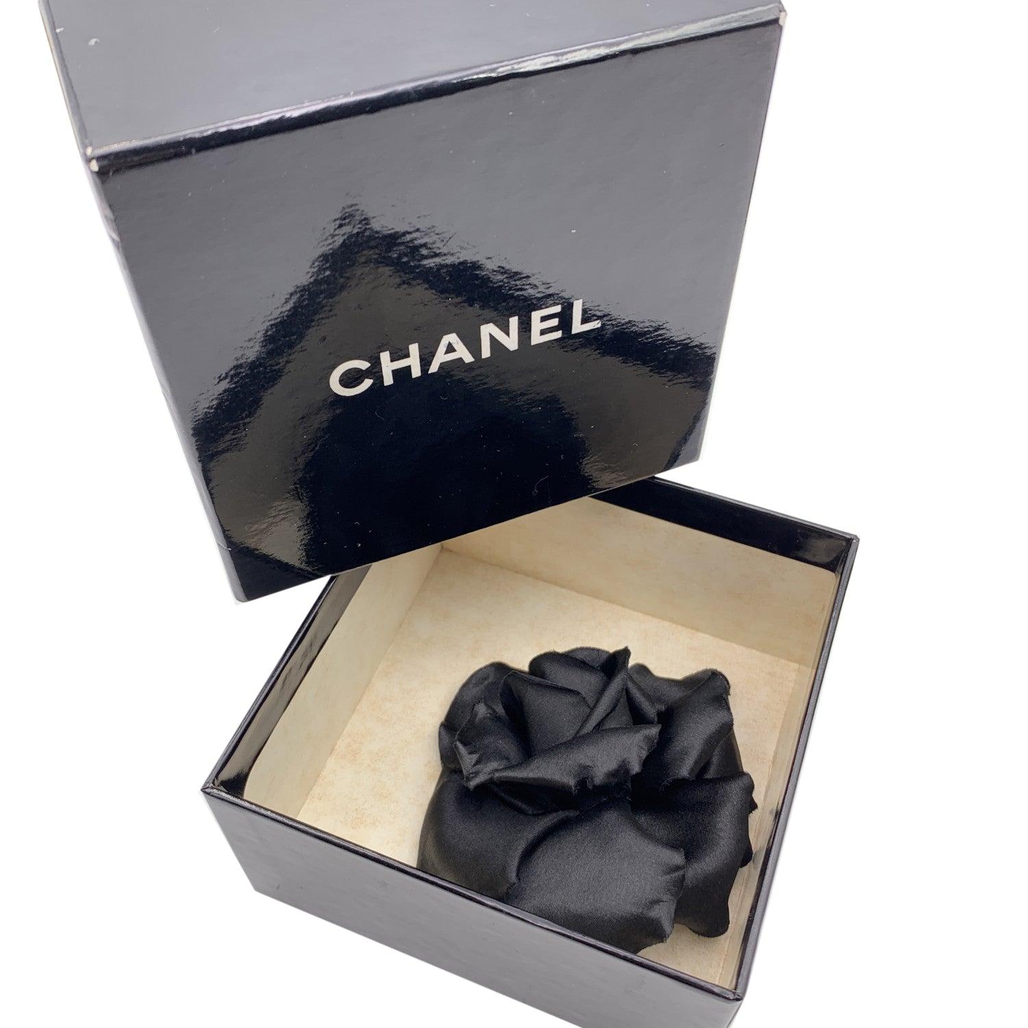 Chanel Vintage black Rose Flower Pin Brooch. Black satin petals. Safety pin closure. Measurements: diameter: 3.5 inches - 8.9 cm. 'CHANEL - CC - Made in France' oval tab on the back Condition A - EXCELLENT Gently used. Chanel box included. Please