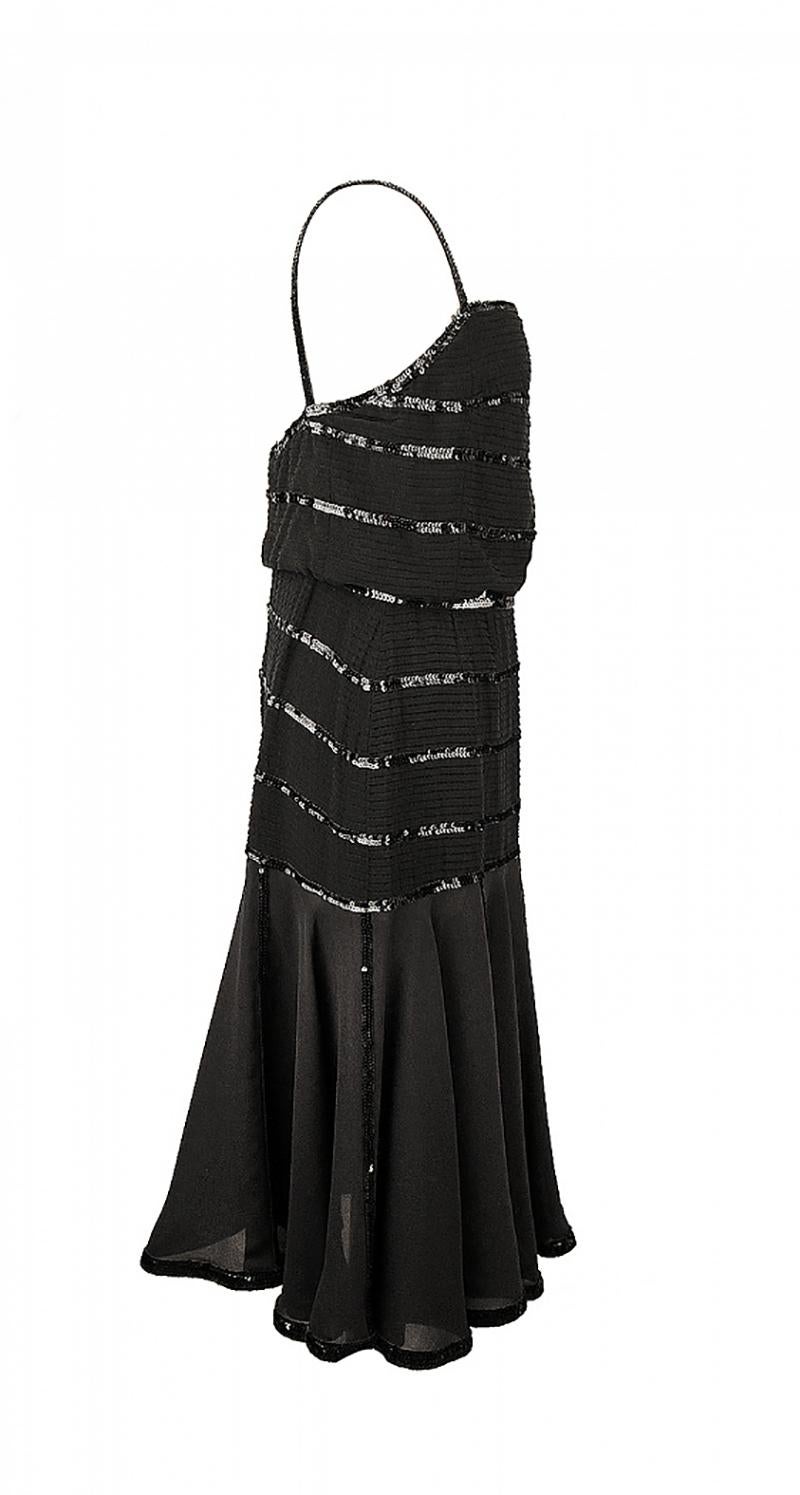 CHANEL

Chanel vintage gown is made of black silk and decorated with black sequins. Draperies on the chest line, pleated skirt. Zipper fastening on the back.
Excellent vintage condition.

1980s, France

Content:  viscose/silk

Size S
Bust: 35.4