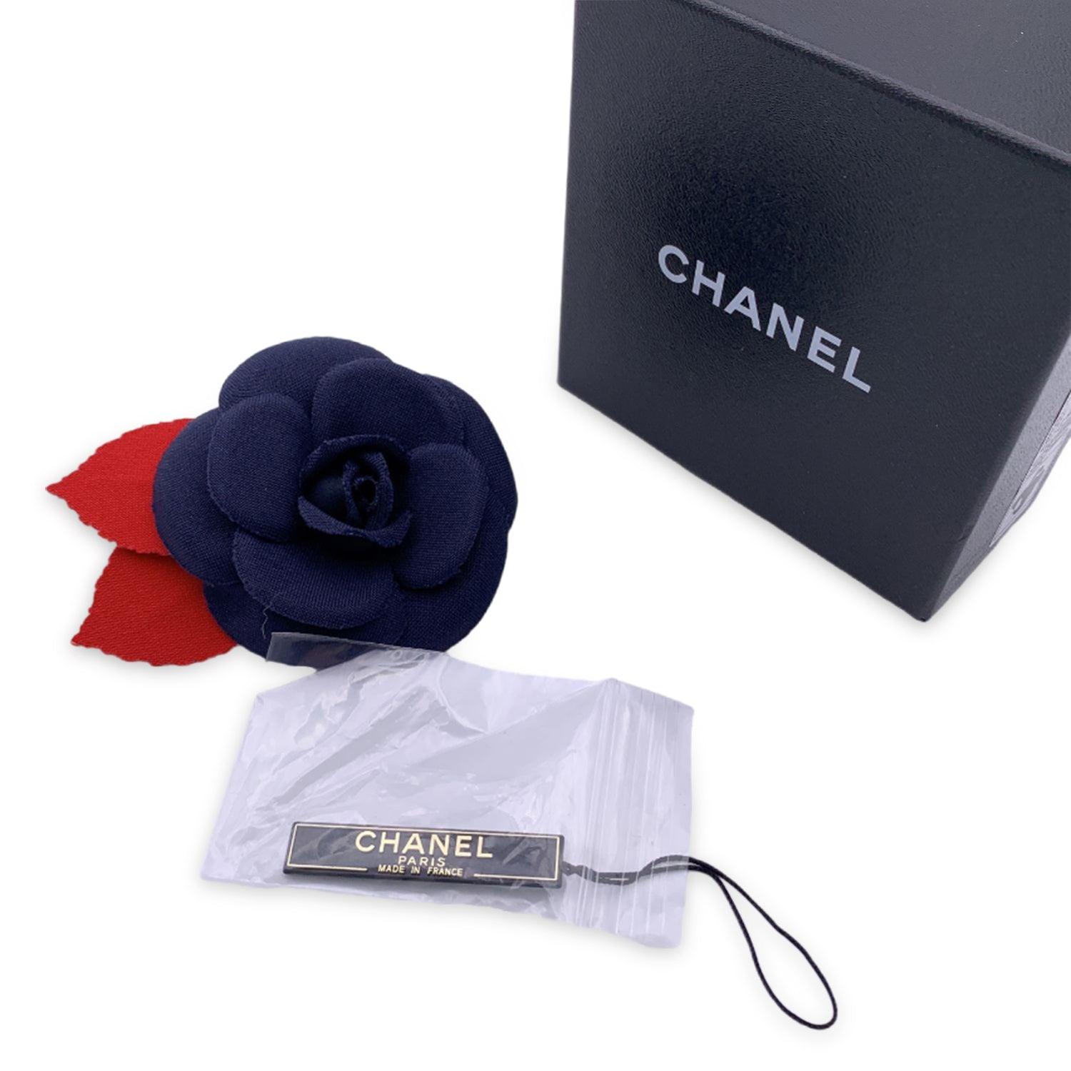 Chanel Vintage Camelia Camellia Flower Pin Brooch. Blue camellia petals with red leaves. Safety pin closure. Diameter: 3 inches - 7.6 cm. 'CHANEL - CC - Made in France' oval tab on the back Condition A - EXCELLENT Gently used. Please check the