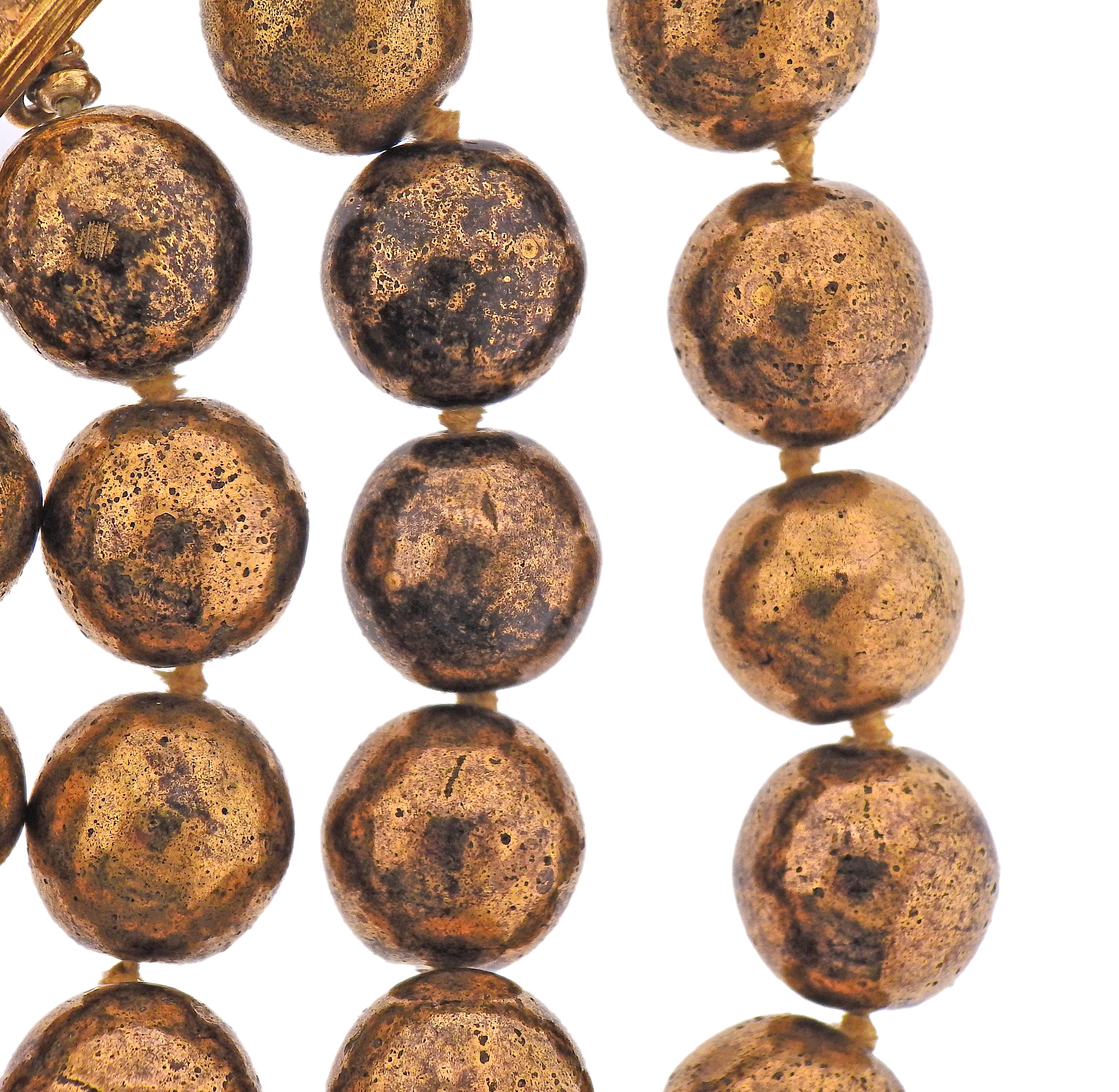 Vintage Chanel costume necklace in bronze tone, with 13.5-14mm balls. Multiple balls have dents, and show tarnishing. Bracelet  is 7