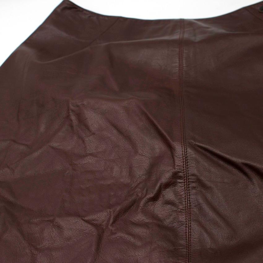 Chanel Vintage Brown Calfskin Leather Midi Skirt

- Soft and supple leather
- 100% Soie silk lining
- Longer at the back
- Concealed zip fastening centre back
- Fixed waistband
- Branded metal plaque stitched onto the left side below the waist