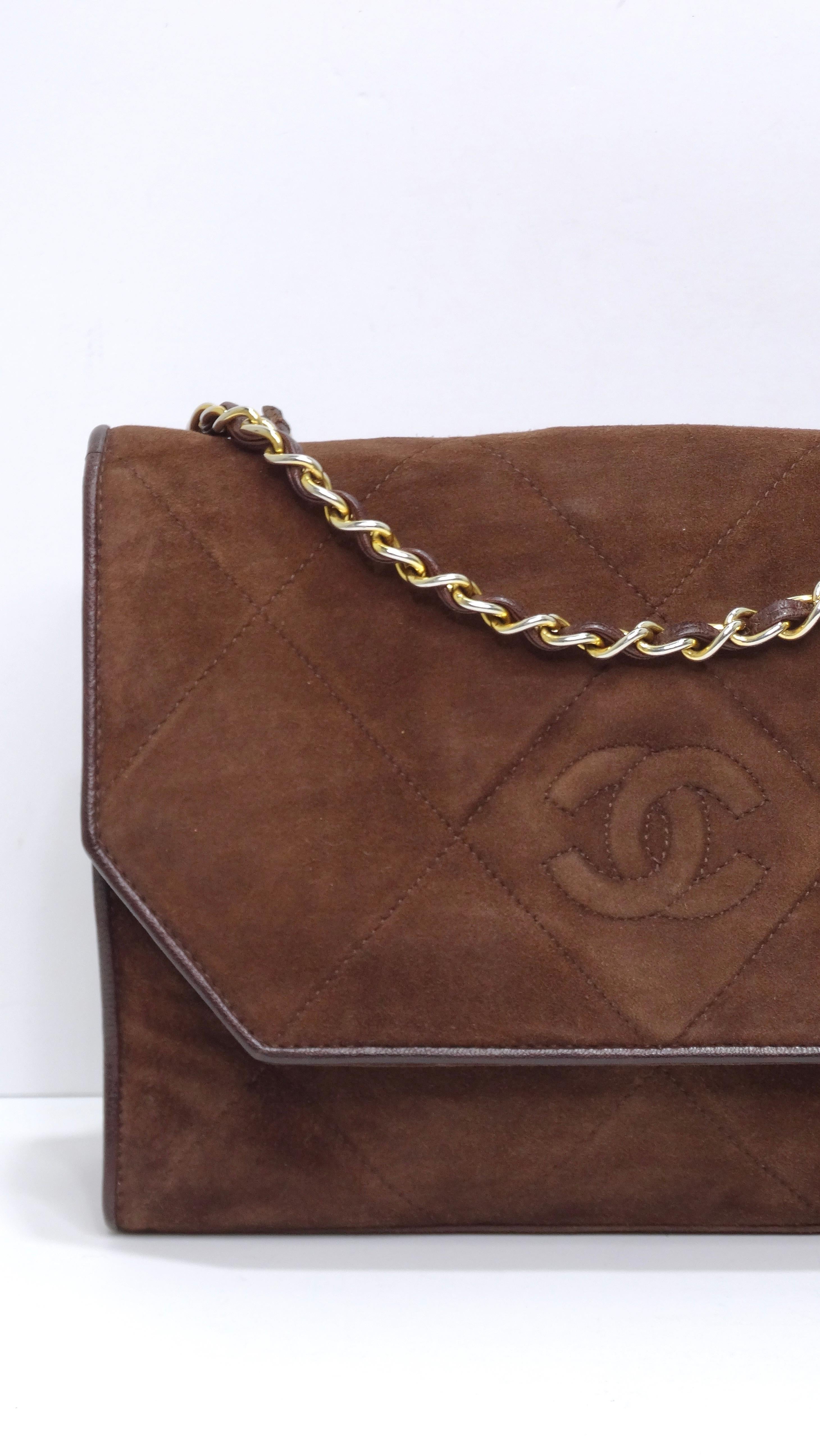 This suede Chanel is your new favorite collectors item! This bag will take you through your everyday as it has a roomy interior and can fit a wallet, keys, phone, and other small items. It features a rich brown quilted suede with matching brown