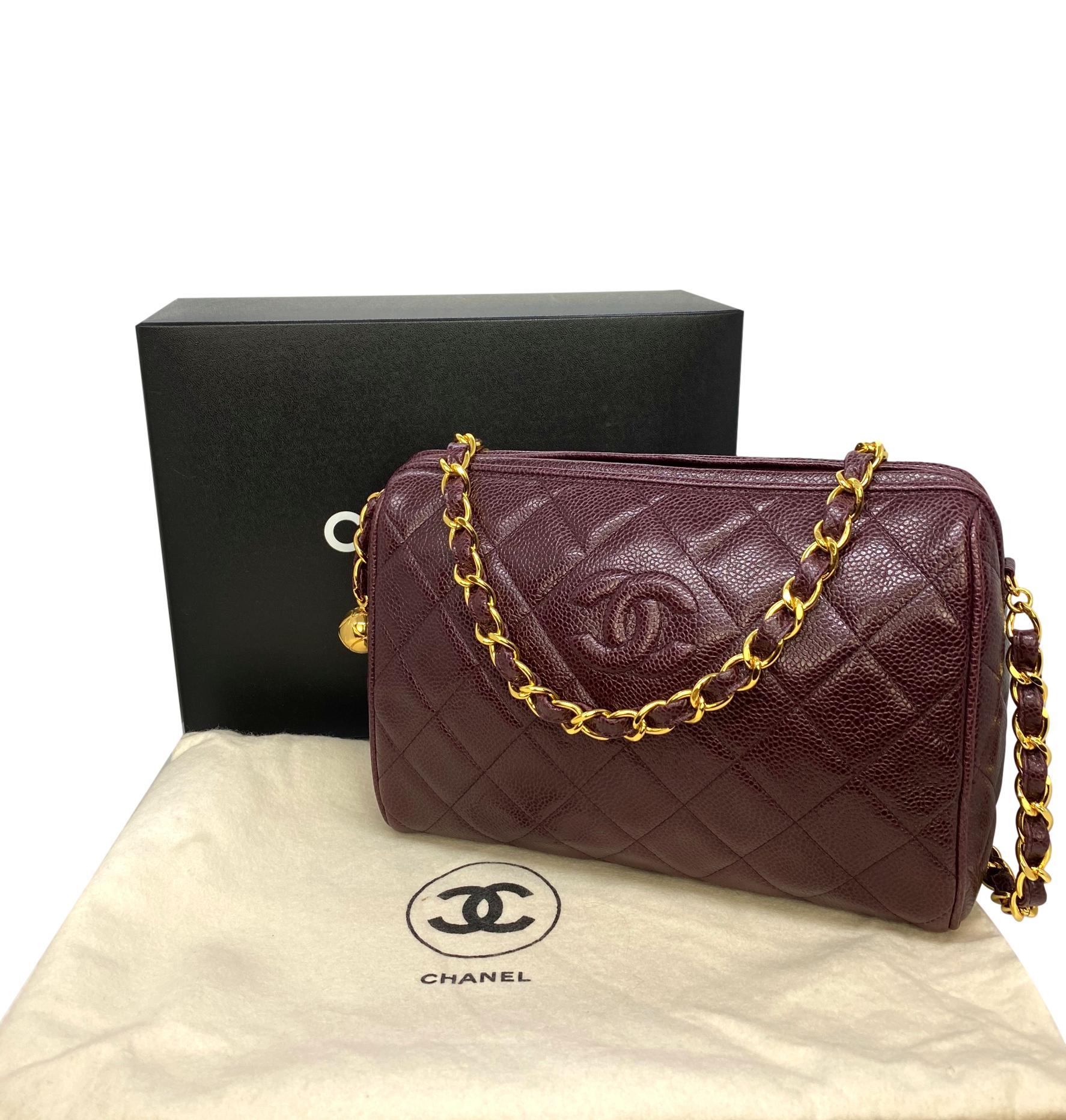 Chanel Vintage Burgundy Quilted Caviar Leather Camera Bag with Gold Hardware. This highly coveted and rare collectible camera bag was produced between 1994 - 1996, baring a serial code of 