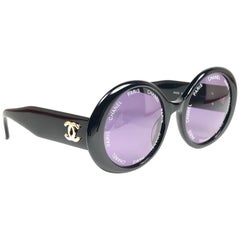 Chanel lunettes de soleil vintage noires à objectif appareil photo fabriquées en Italie, printemps/été 1993 