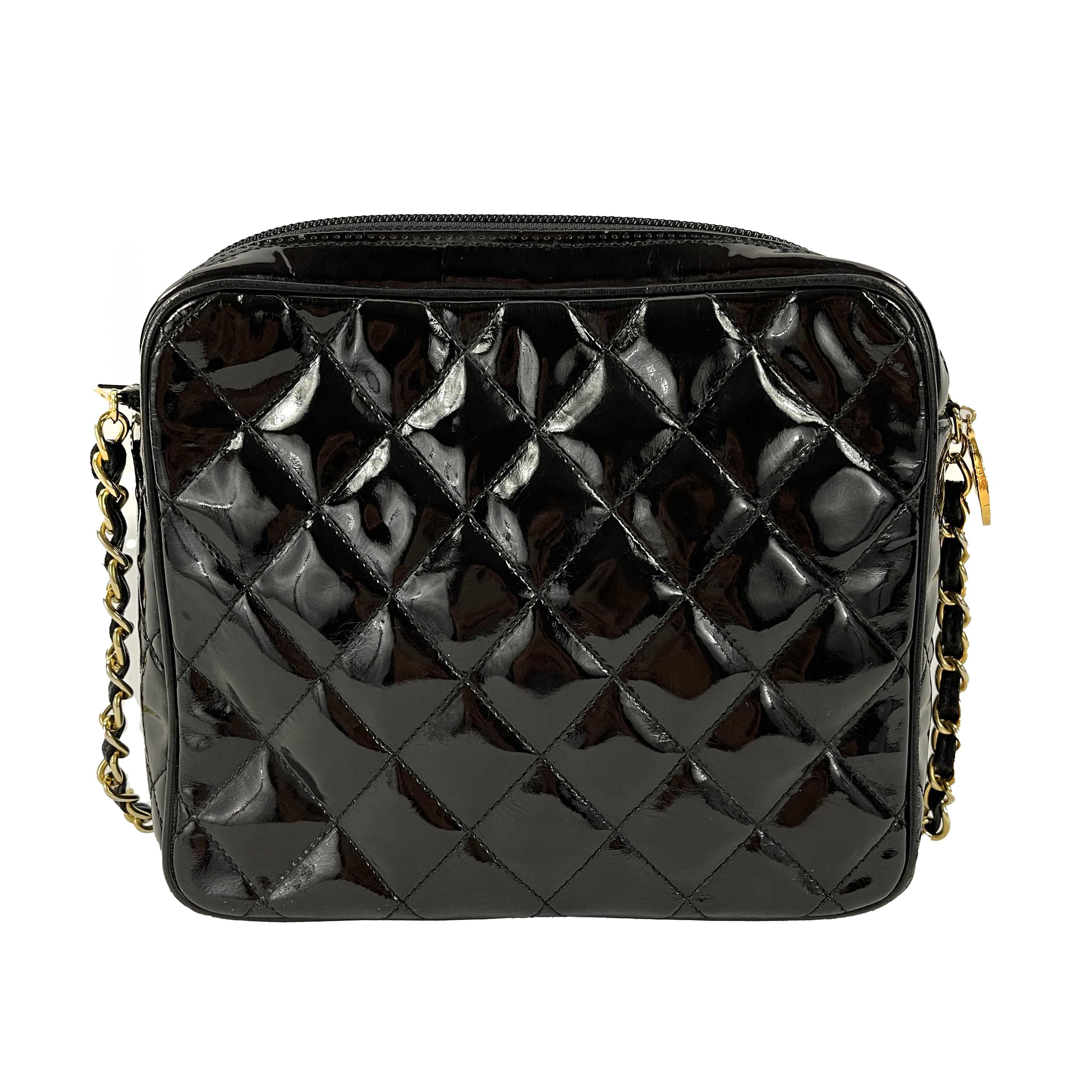 CHANEL Vintage Camera Quilted Black Patent CC Fold Over Crossbody / Shoulder Bag

Description

Vintage 1980's era collection.
Crafted in quilted black patent leather, featuring a 'CC' logo embroidered fold over flap on front pocket and engraved