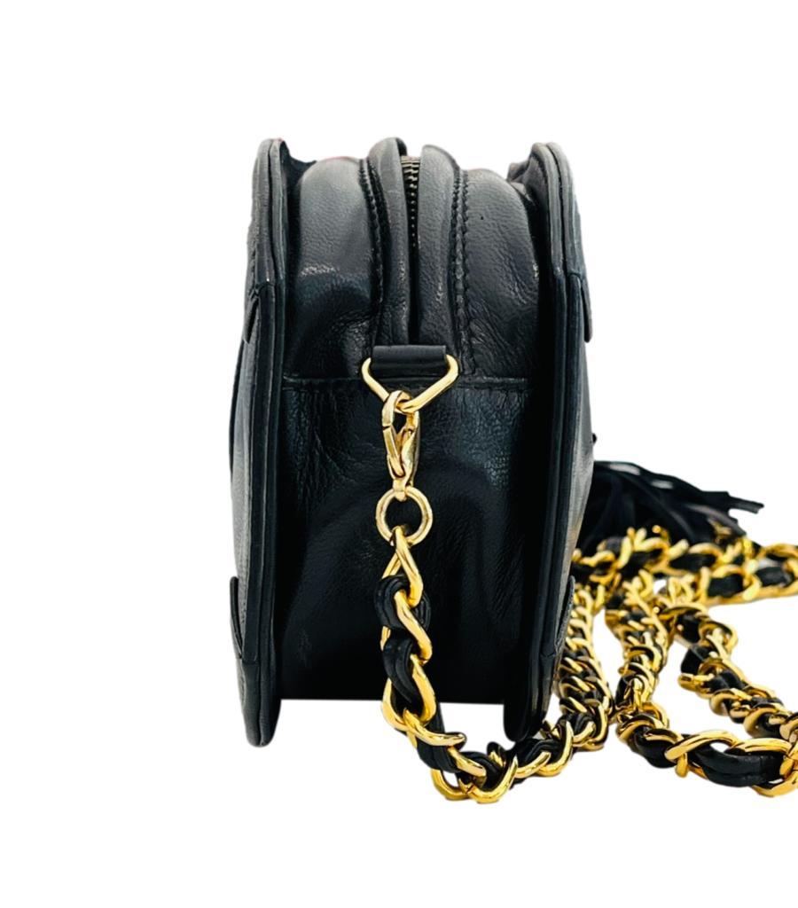 Chanel Vintage 'CC' Caviar Leather Mini Camera Bag
Black crossbody bag crafted in caviar leather and designed with oversized 'CC' logo embossment to the front.
Detailed with leather tassel and gold chain and leather detachable shoulder