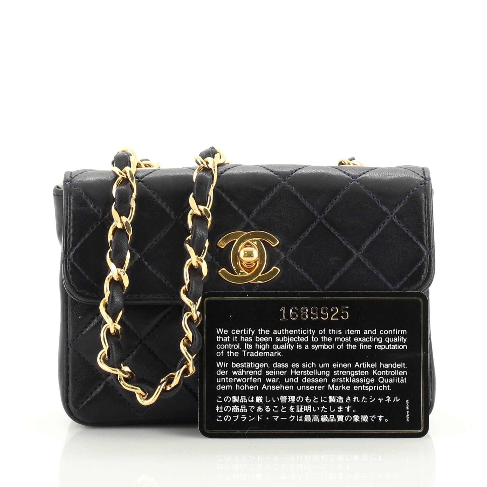 This Chanel Vintage CC Chain Flap Bag Quilted Leather Extra Mini, crafted from blue quilted leather, features woven-in leather chain link strap and gold-tone hardware. Its CC turn-lock closure opens to a red leather interior. Hologram sticker reads: