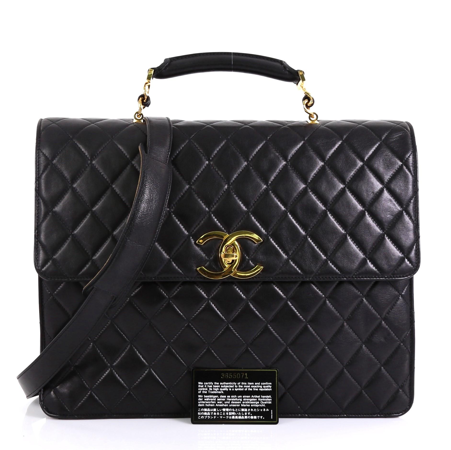 This Chanel Vintage CC Convertible Briefcase Quilted Lambskin Large, features leather top handle, exterior back slip pocket, and gold-tone hardware. Its CC turn-lock closure opens to a black satin interior zip pockets. Hologram sticker reads: