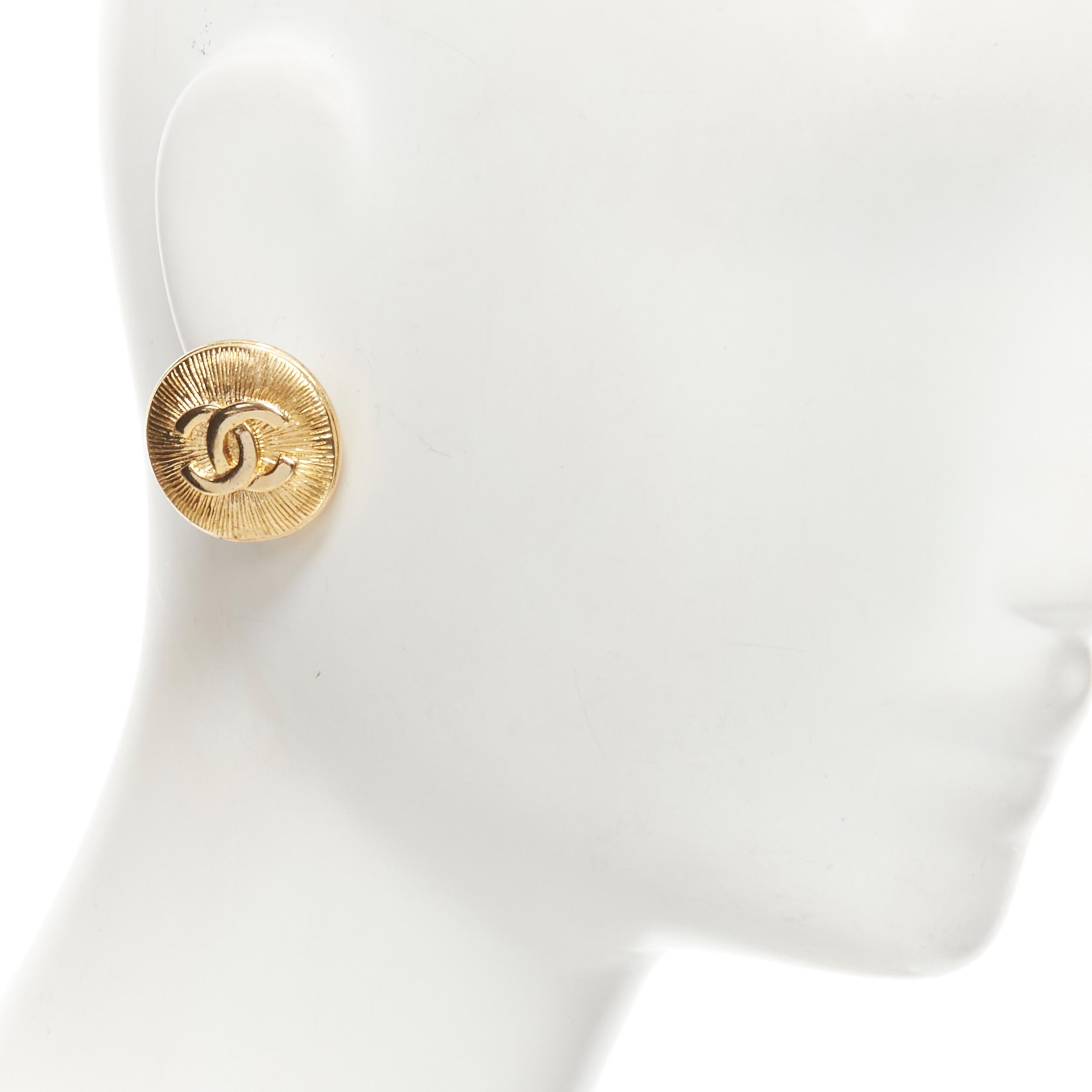 CHANEL Vintage CC logo gold starburst textured clip on earrings 
Reference: GIYG/A00233 
Brand: Chanel 
Designer: Karl Lagerfeld 
Material: Metal 
Color: Gold 
Pattern: Logo 
Closure: Clip On
Extra Detail: Gold-tone CC logo with textured starburst