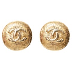 CHANEL Vintage CC logo gold starburst textured clip on earrings