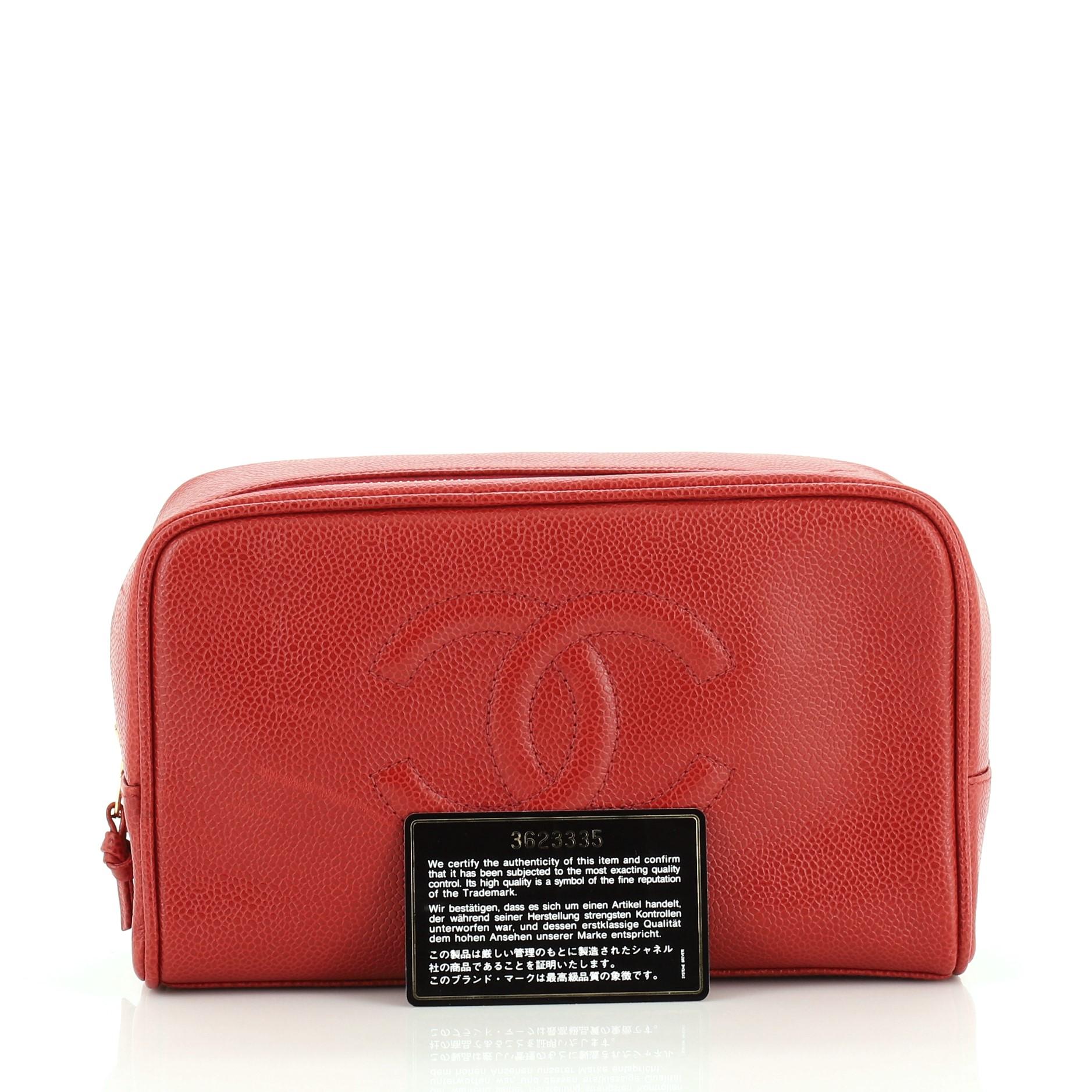 This Chanel Vintage CC Toiletry Pouch Caviar, crafted in red caviar leather, features a stitched CC logo and gold-tone hardware. Its zip closure opens to a red leather interior with zip pocket. Hologram sticker reads: 3623335.

Condition: Very good.