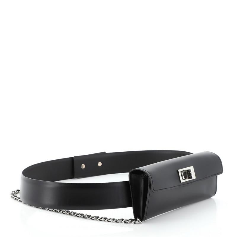 This Chanel Vintage Chain Mademoiselle Belt Bag Calfskin is a chic piece with a versatile day-to-night transition. Crafted from black calfskin leather, features leather belt strap, woven-in leather chain, and silver-tone hardware. Its mademoiselle