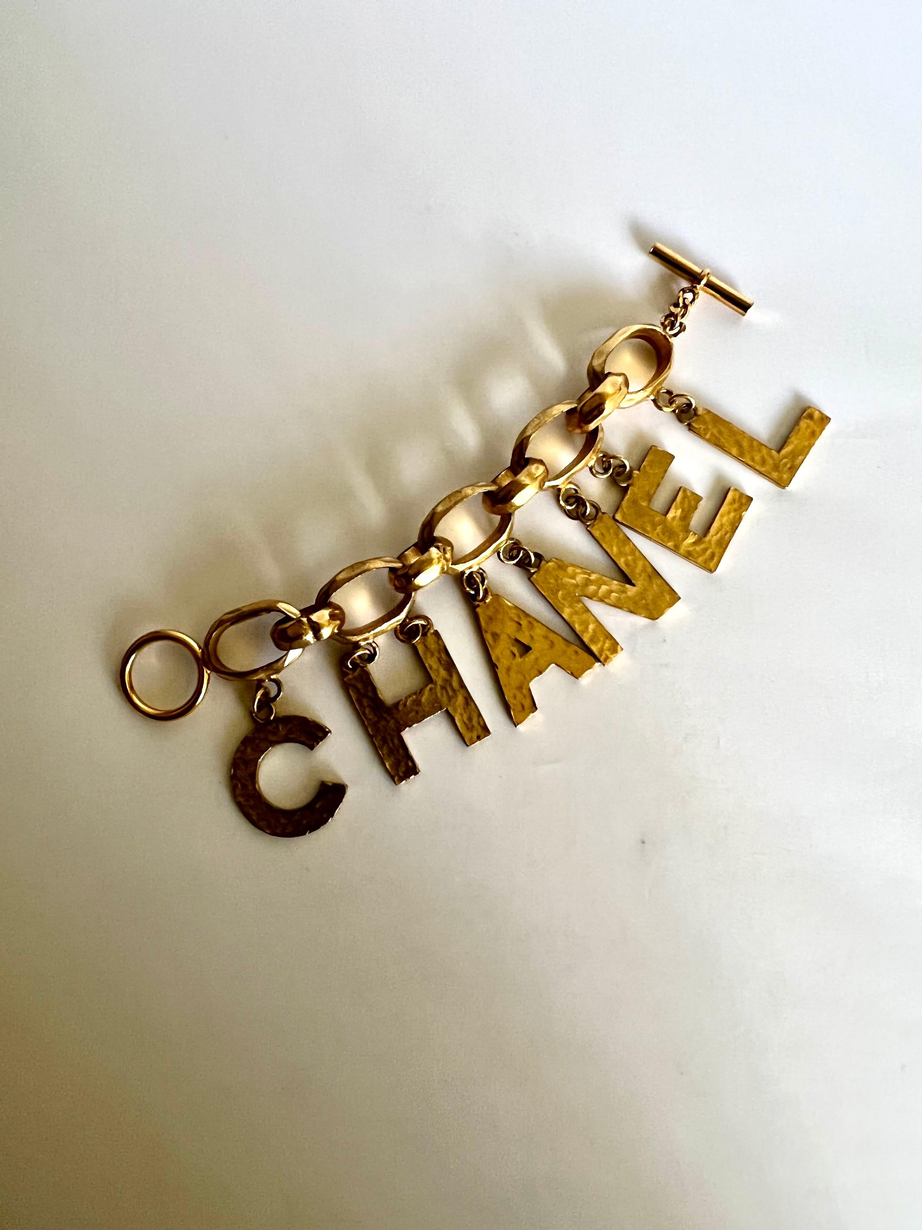 Chanel Vintage Chunky Gilt Letter Charm Bracelet In Excellent Condition In Palm Springs, CA
