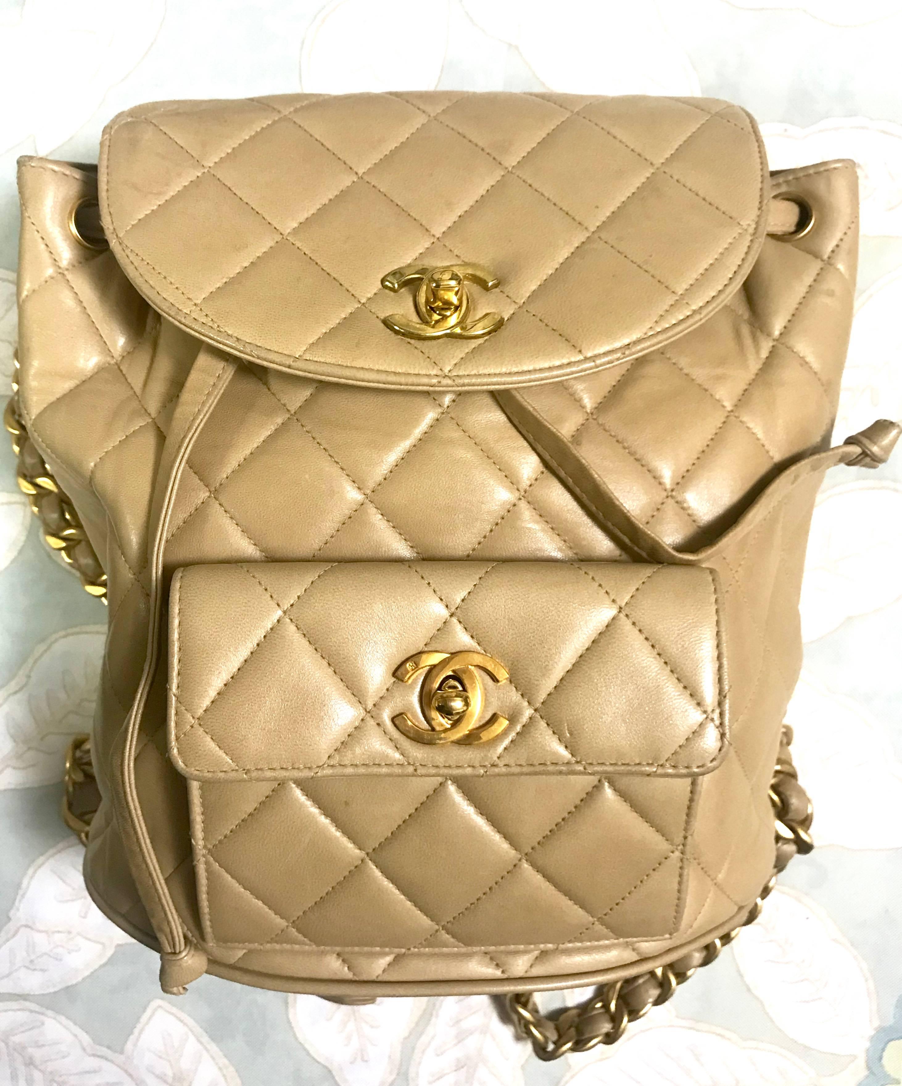 1990s. Vintage CHANEL classic beige lamb leather 2.55 backpack with gold chain strap and CC closure. Classic and popular bag.

Introducing classic 2.55 backpack in beige lambskin from CHANEL back in the 90's.  Don't miss it!

Featuring gold tone