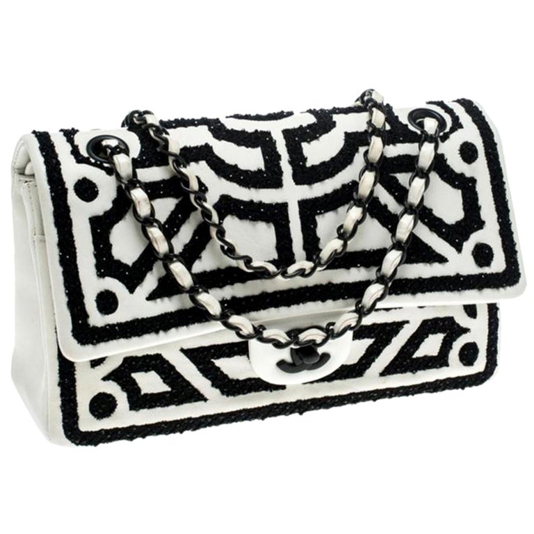 black classic chanel handbag white