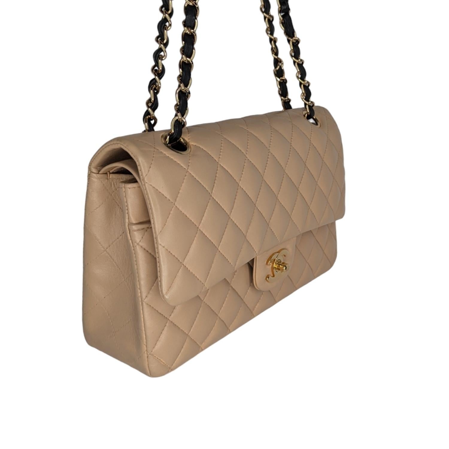 From the 2005 Collection by Karl Lagerfeld; Chanel Classic Lambskin Quilted Medium Double Flap. This stylish vintage flap bag is finely crafted of diamond quilted lambskin leather in beige. The bag features a gold chain and black leather threaded