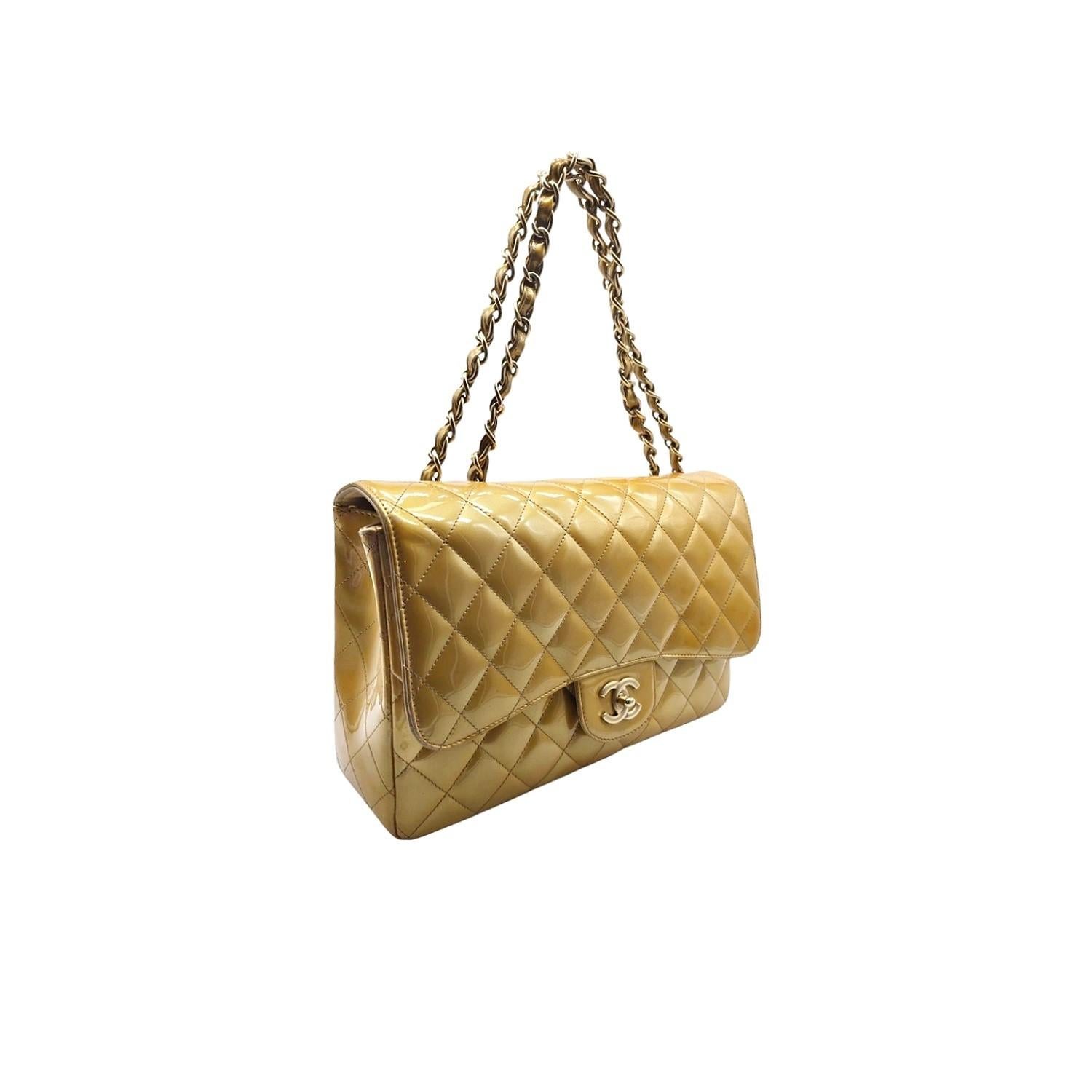 This Chanel Patent Quilted Jumbo Single Flap is crafted of fine diamond-quilted glossy patent leather. The bag features leather threaded gold chain shoulder straps and a facing half flap with a light gold Chanel CC turn lock. This opens to a matte